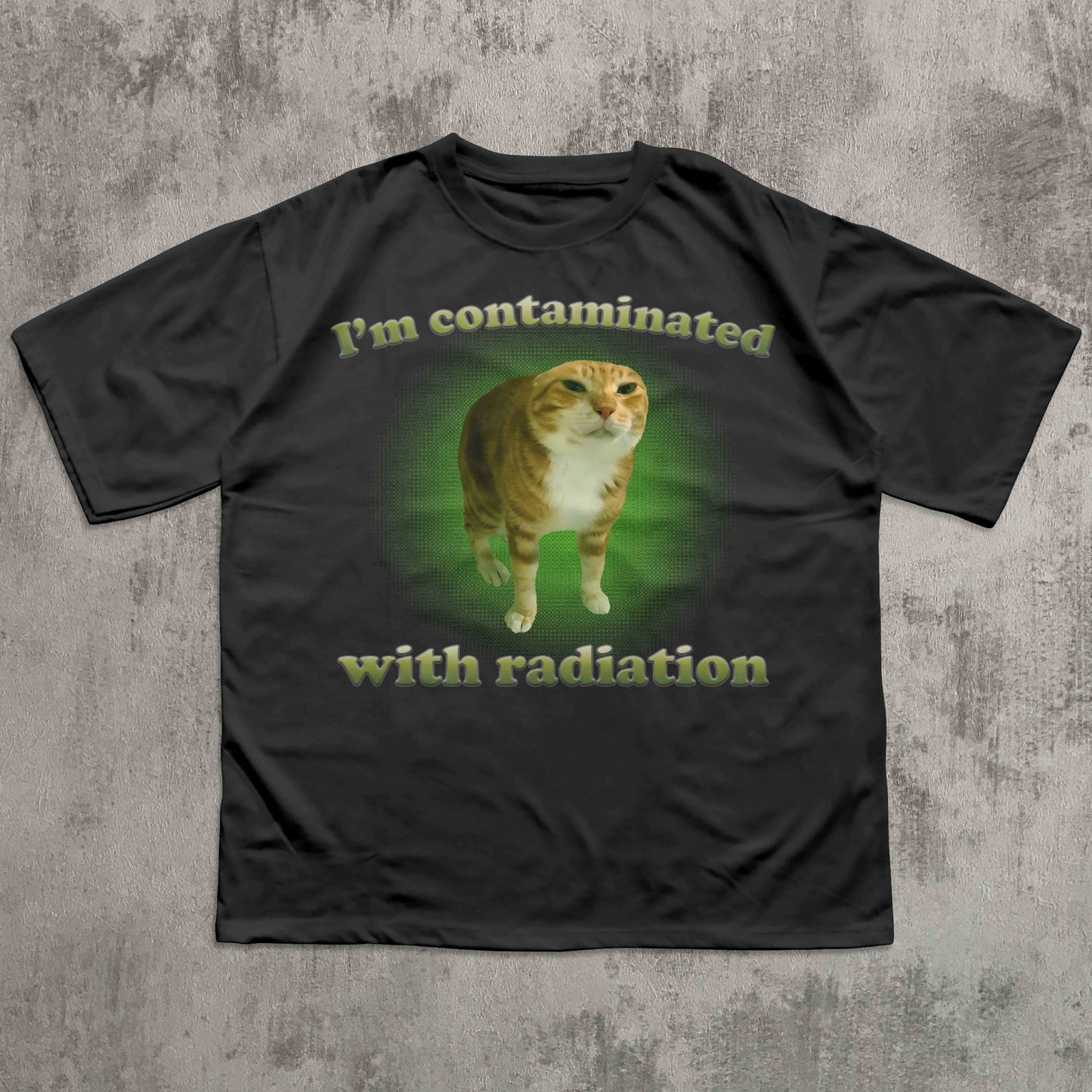 Black t-shirt with a cat graphic and text on a textured gray background