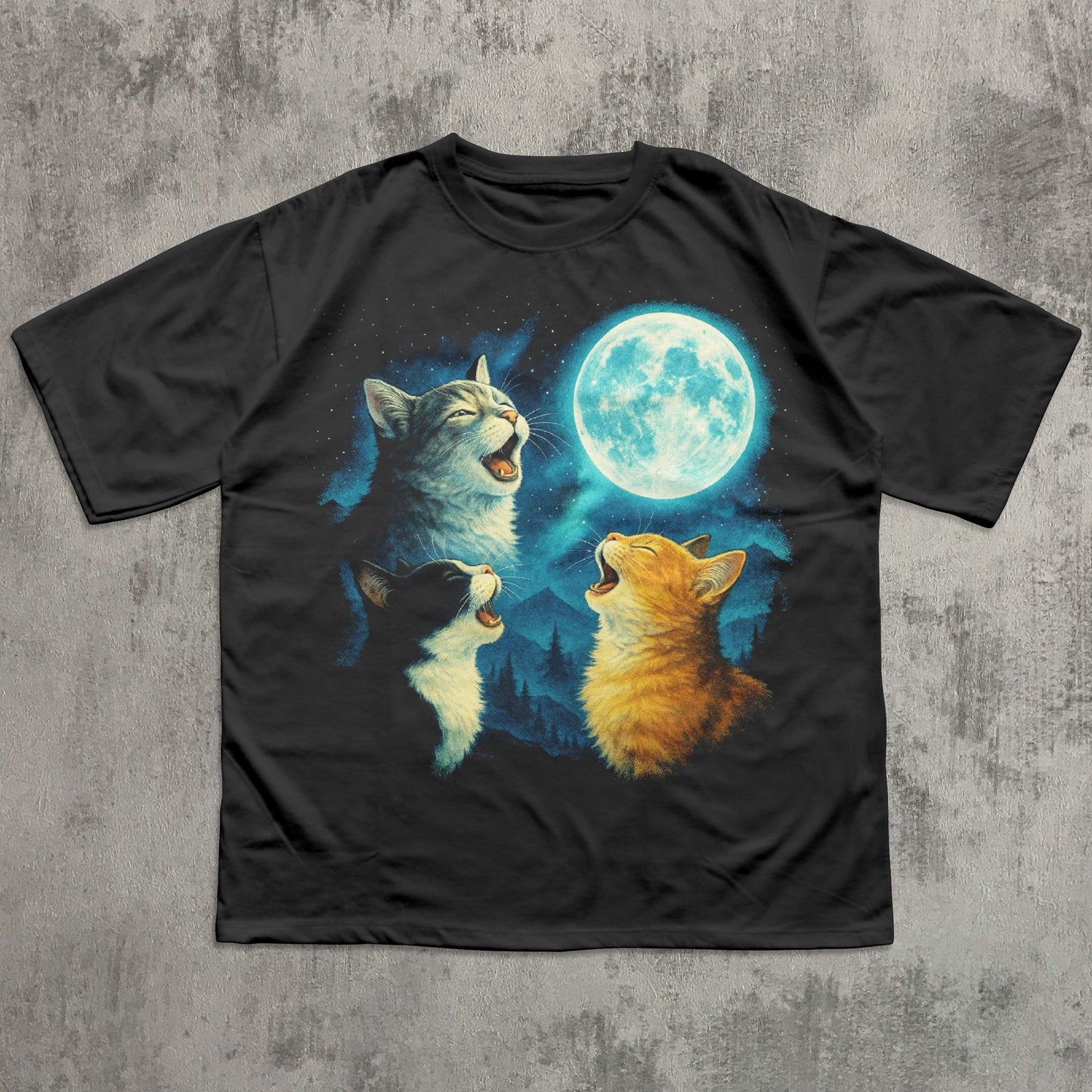 Black t-shirt with a graphic of three meowing cats under a moonlit sky on a textured gray background.