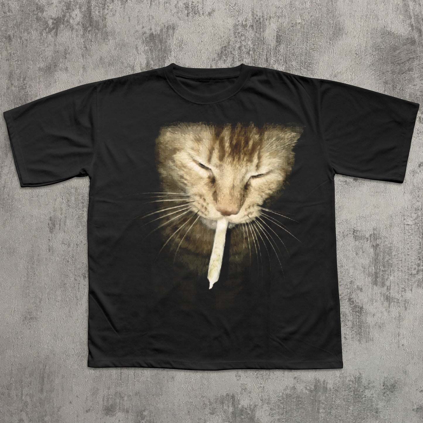 Black t-shirt with a cat graphic on a textured gray background