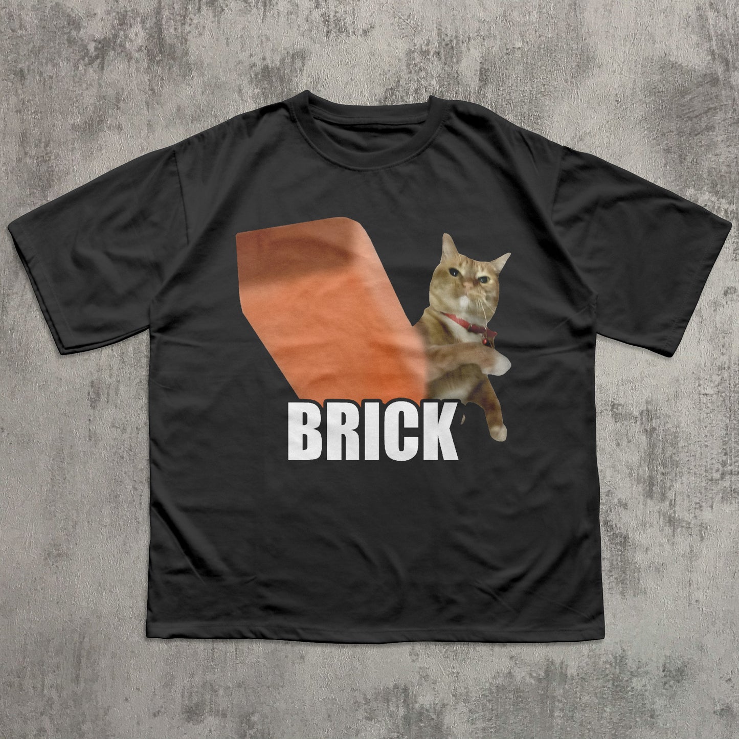 Black t-shirt with a graphic of a cat labeled 'BRICK' on a textured gray background