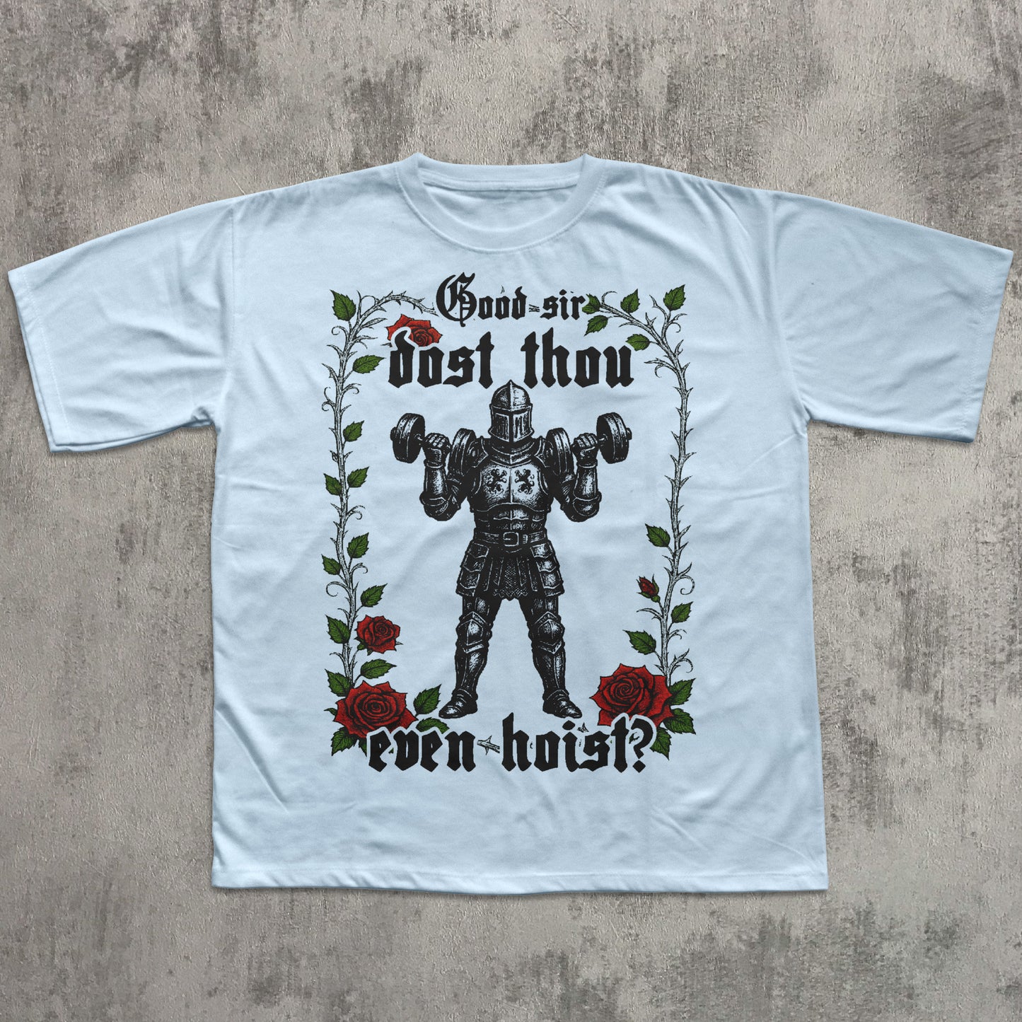 White t-shirt with a graphic design of a knight lifting weights, roses, and text on a concrete background.