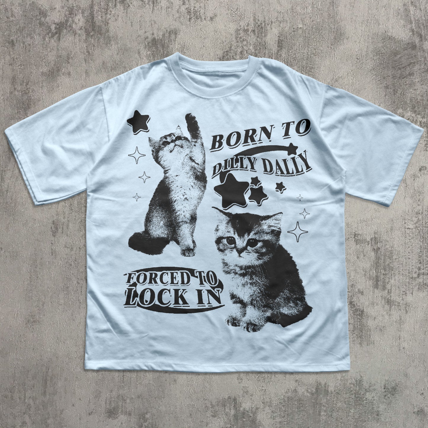 White t-shirt with black cat graphic and text on a textured gray background