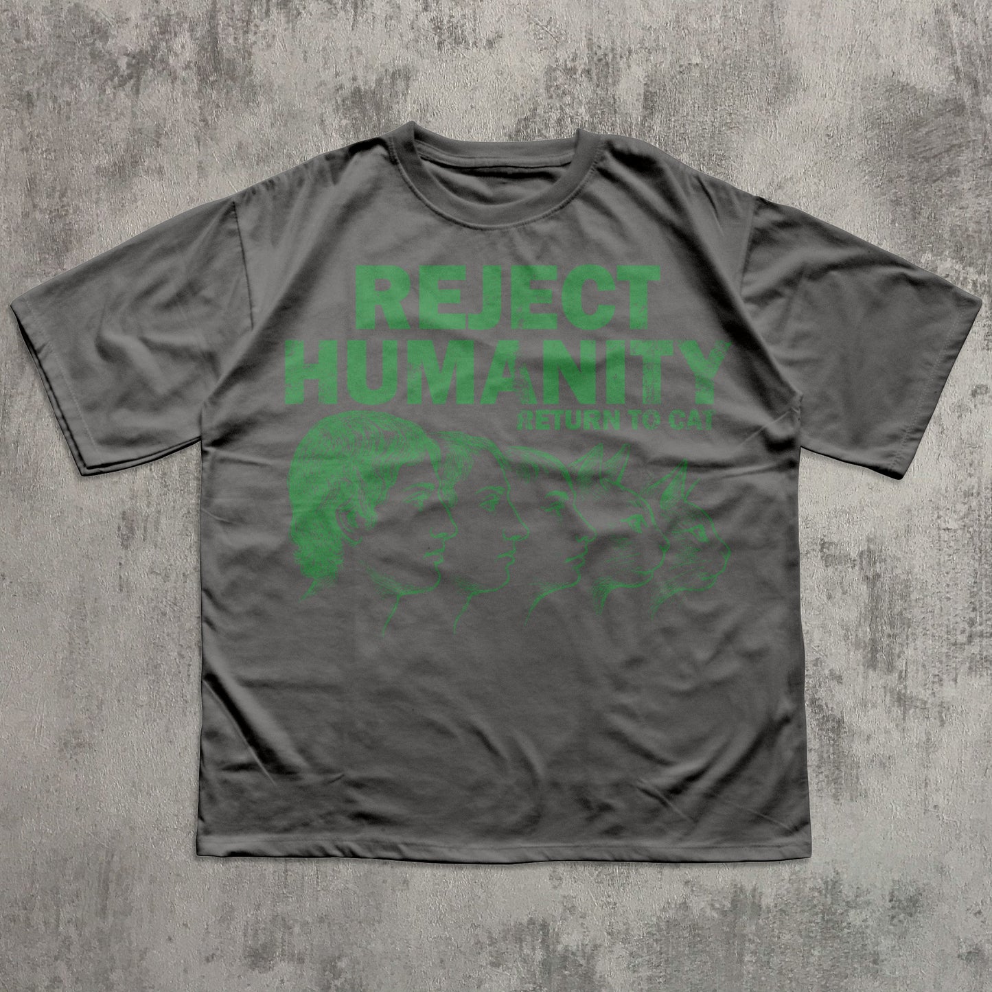 Gray t-shirt with green text 'REJECT HUMANITY' on a textured gray background