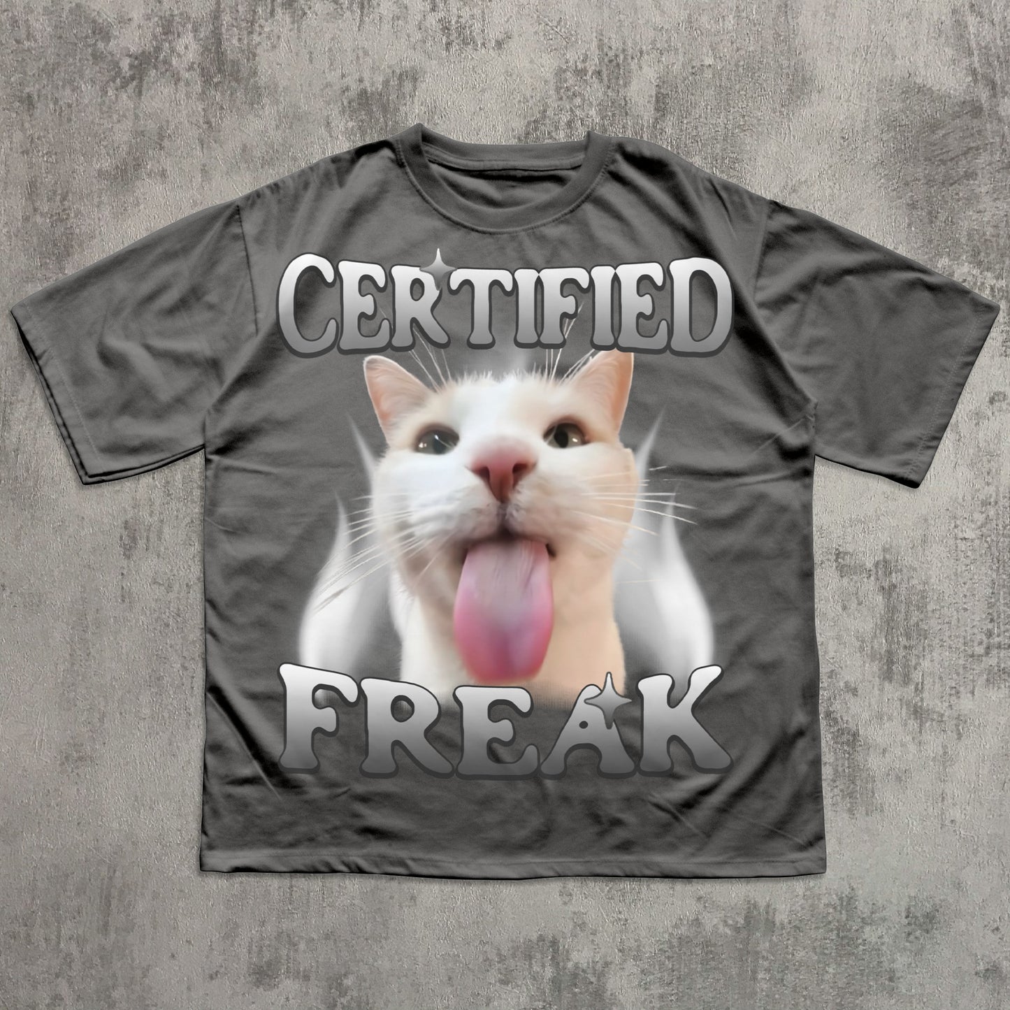 Gray t-shirt with a cat graphic and 'Certified Freak' text on a textured gray background