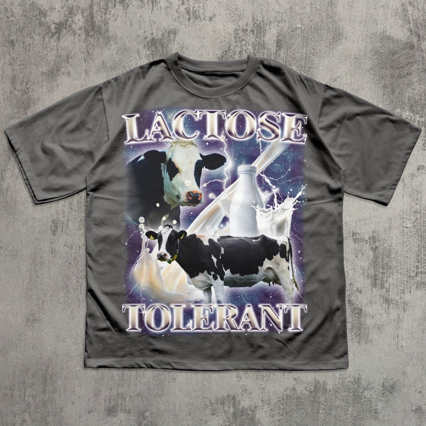 Funny Gray t-shirt with a graphic of cows and milk, and the text 'LACTOSE TOLERANT' on a concrete background.