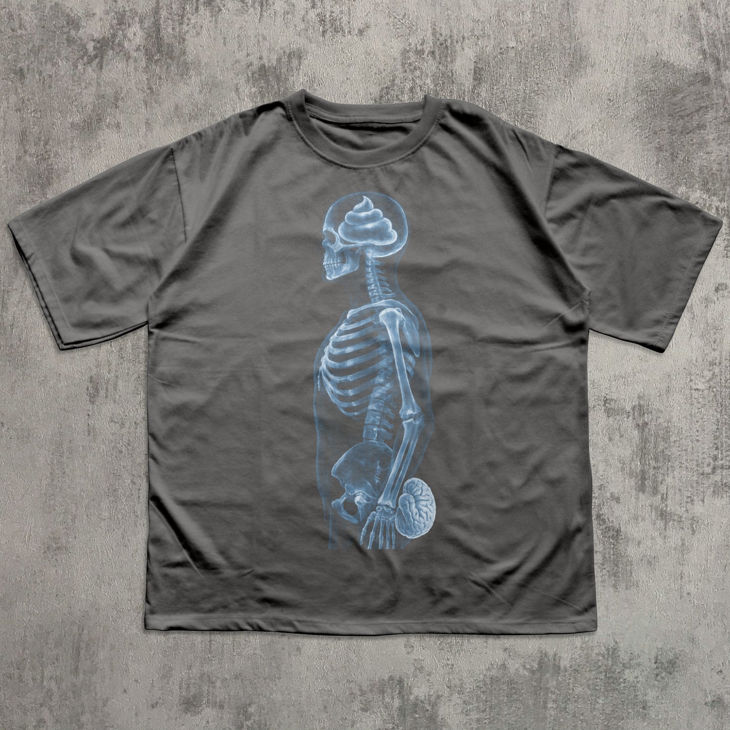 Humorous gray graphic T-shirt featuring a blue X-ray skeleton with a poop-shaped brain in the skull and the brain held at the crotch, funny anatomy joke shirt