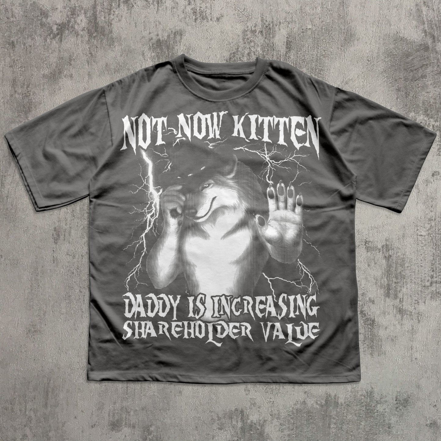 Gray t-shirt with graphic design and text on a textured gray background