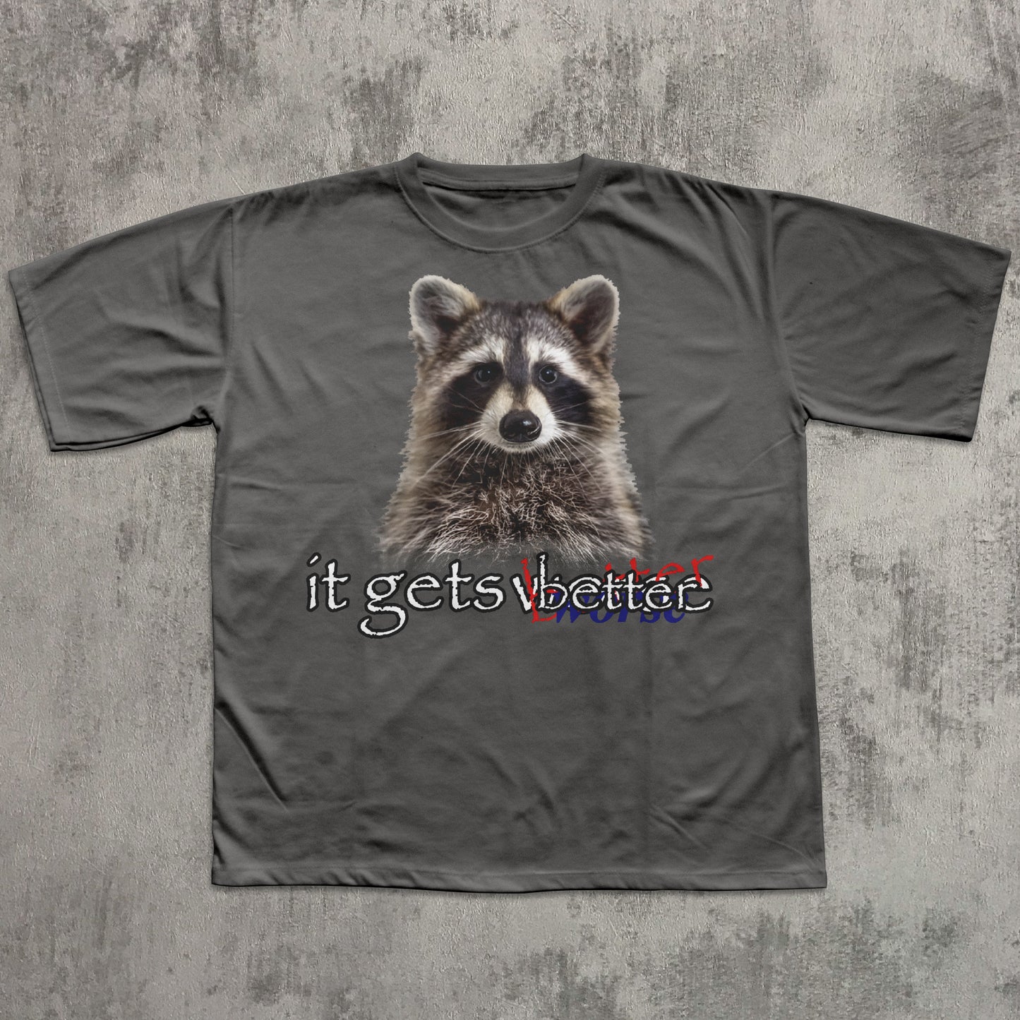 Gray t-shirt with a raccoon graphic and text on a textured gray background