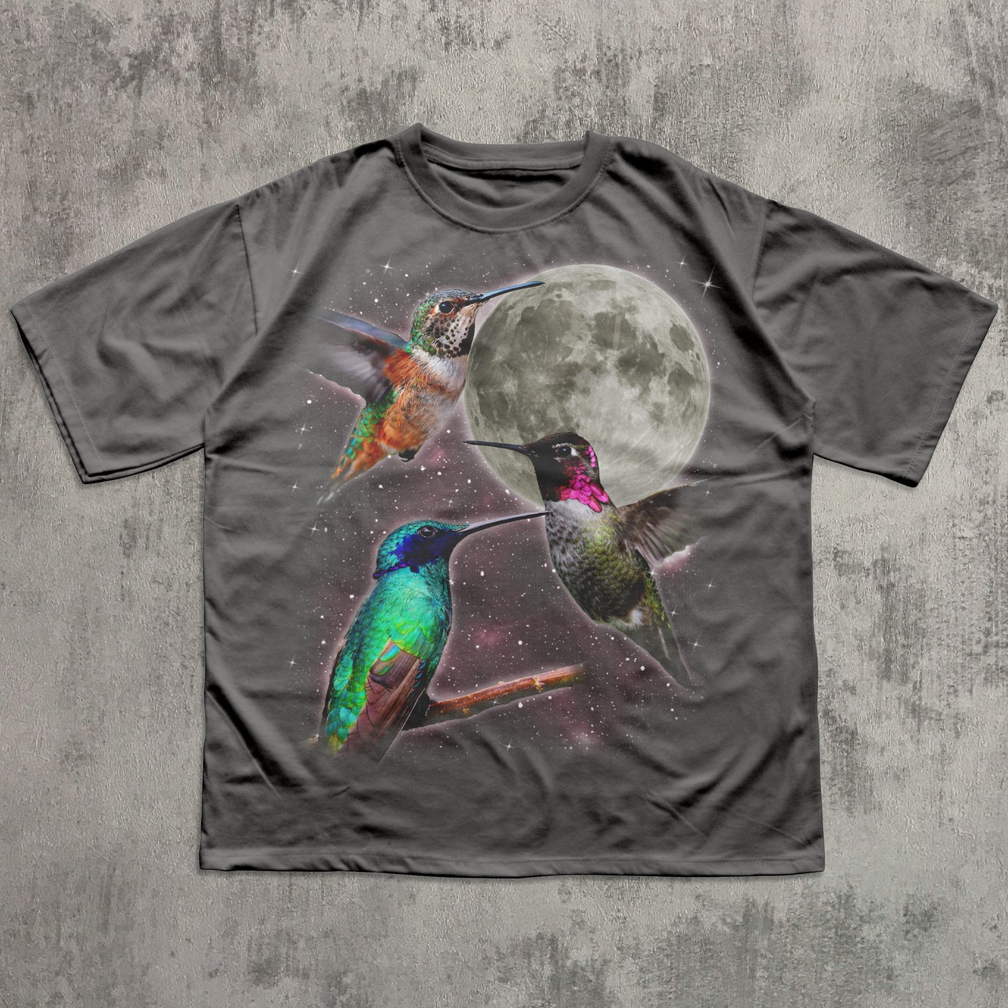 Gray t-shirt with colorful hummingbird design on a textured gray background