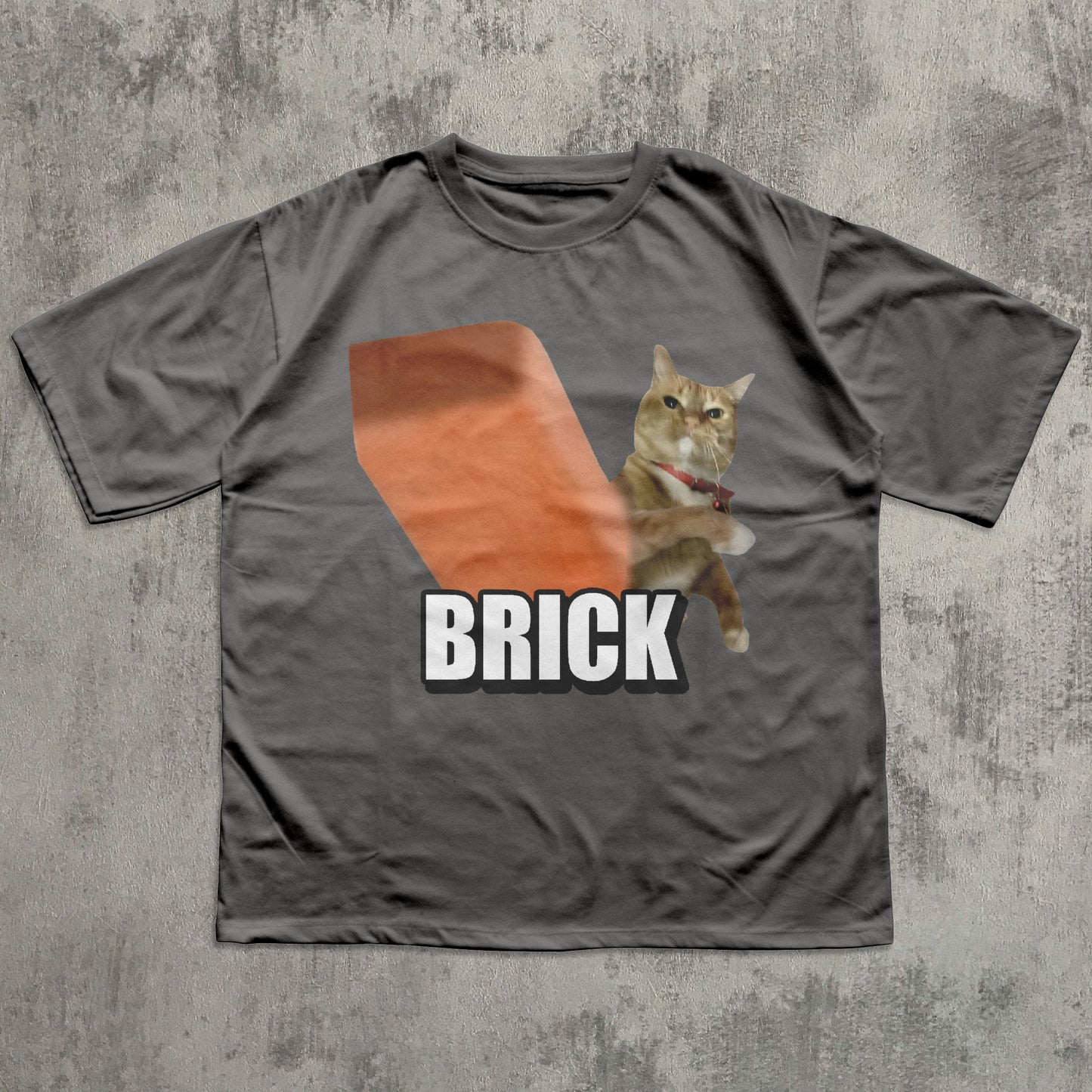Gray t-shirt with a cat graphic and 'BRICK' text on a textured gray background