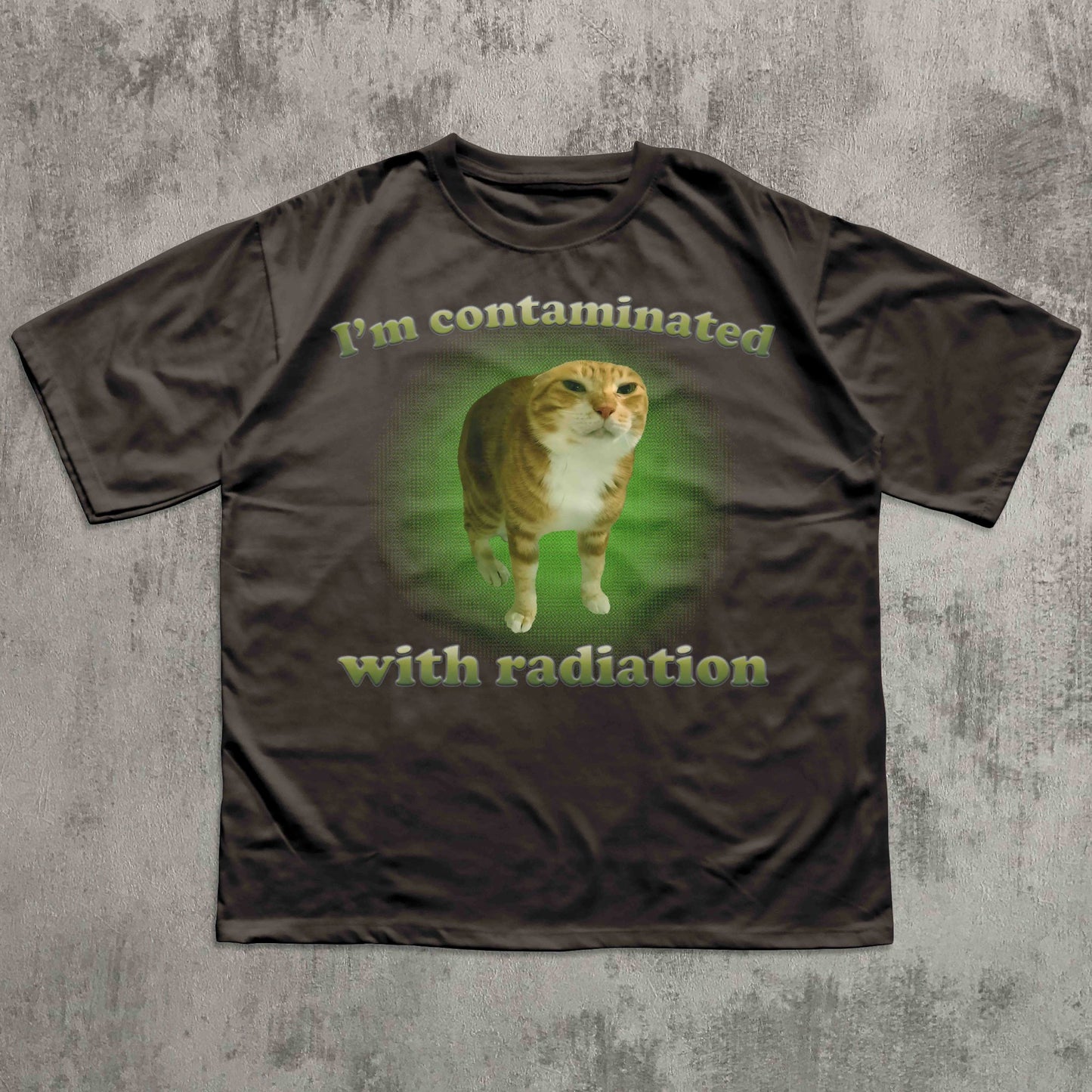 Brown t-shirt with a cat graphic and text on a textured gray background