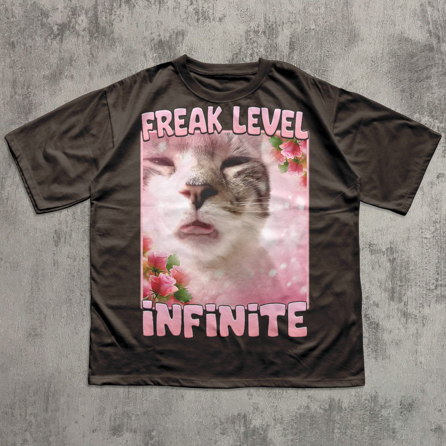 Funny T-shirt with a cat graphic and text 'Freak Level Infinite' on a textured gray background