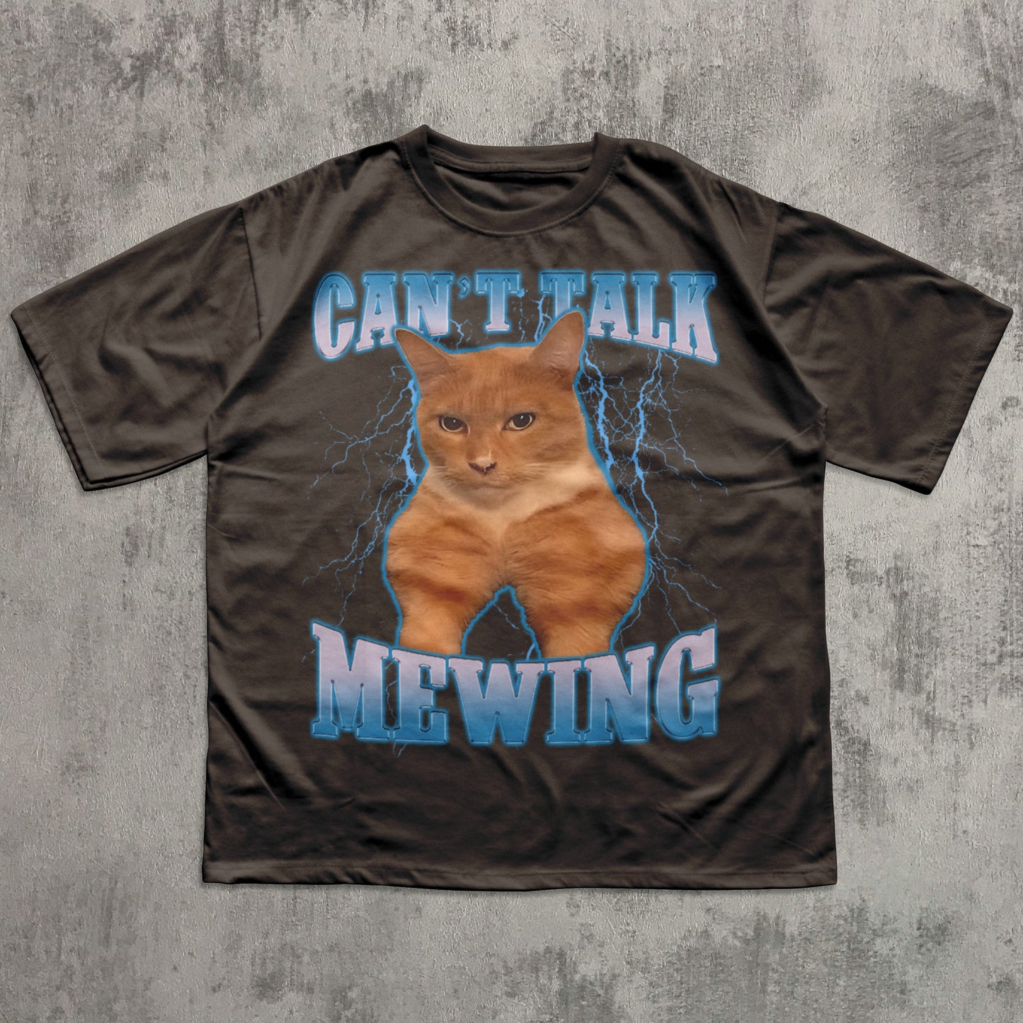 Funny Brown t-shirt with a cat graphic and text 'CAN'T TALK MEOWING' on a textured gray background