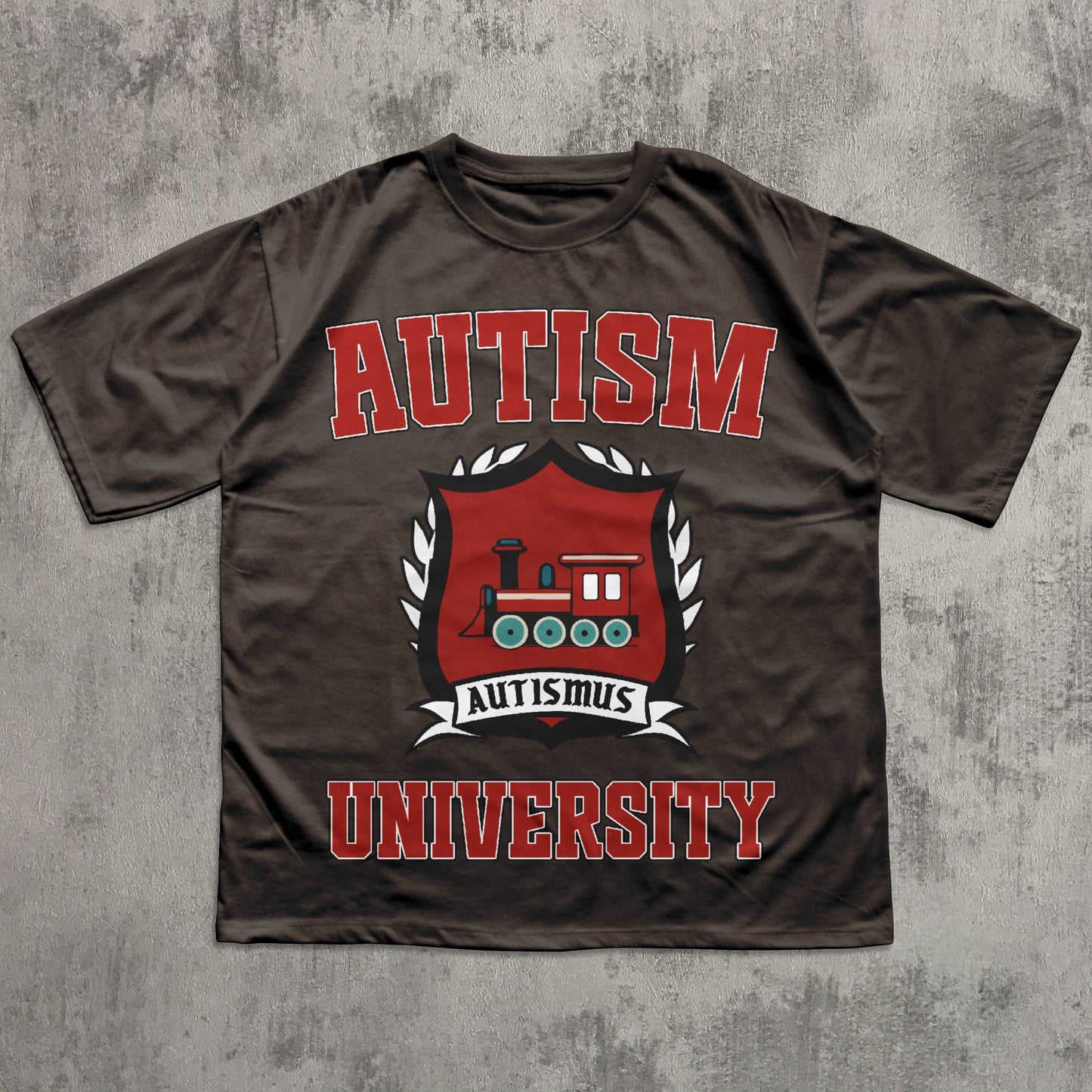 Brown t-shirt with 'Autism University' text and graphic on a textured gray background