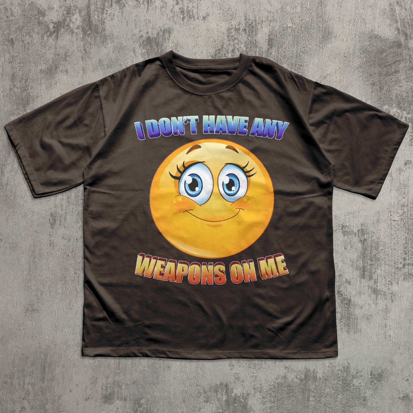 Brown t-shirt with a smiley face and text on a gray textured background