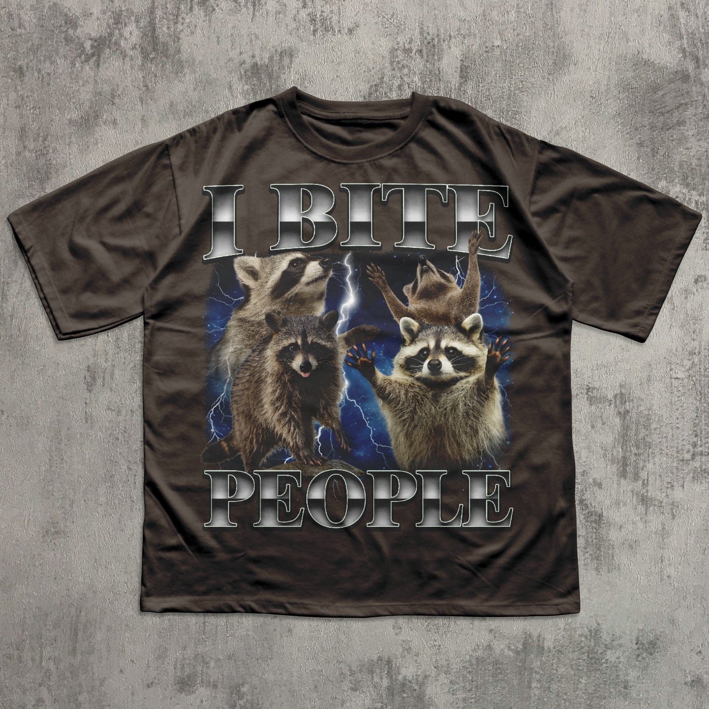 T-shirt with raccoon graphic and text 'I BITE PEOPLE' on a textured gray background