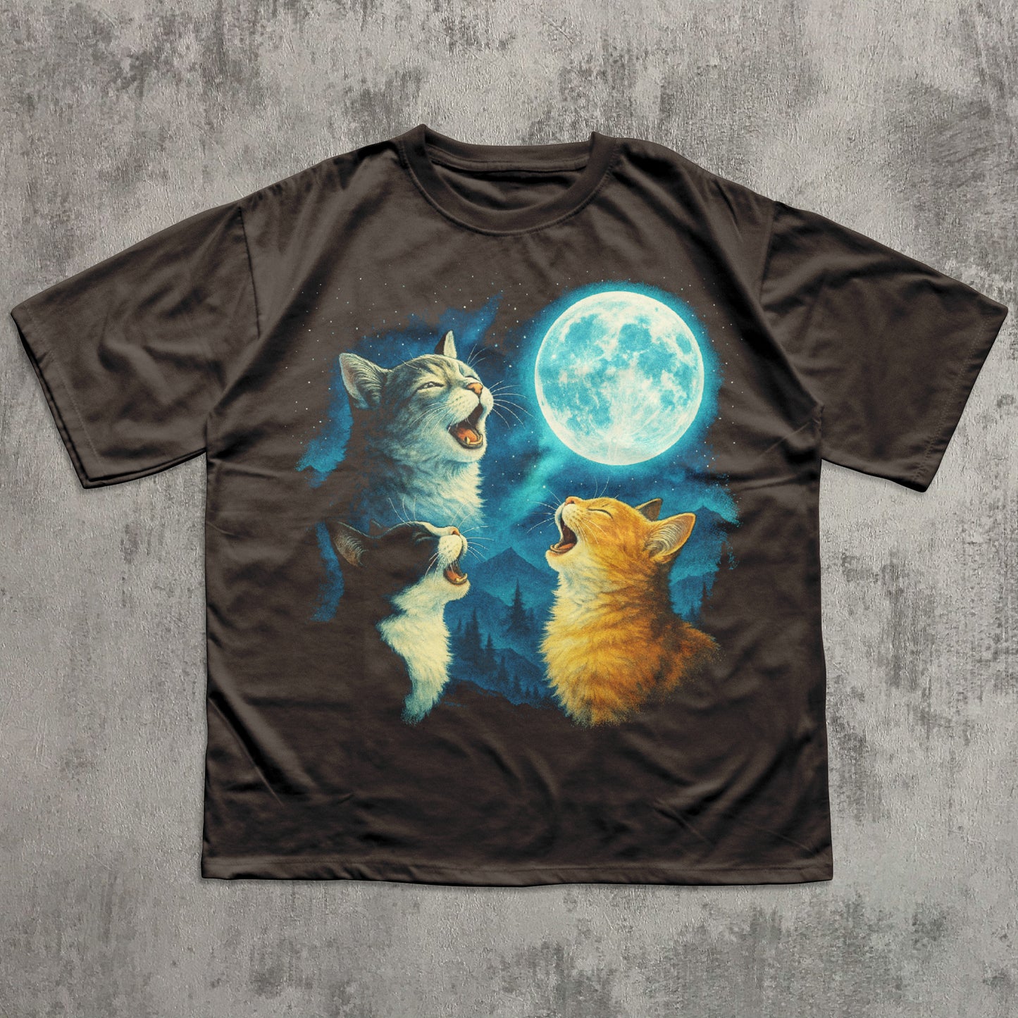 T-shirt with a design of three meowing cats around a full moon on a textured gray background