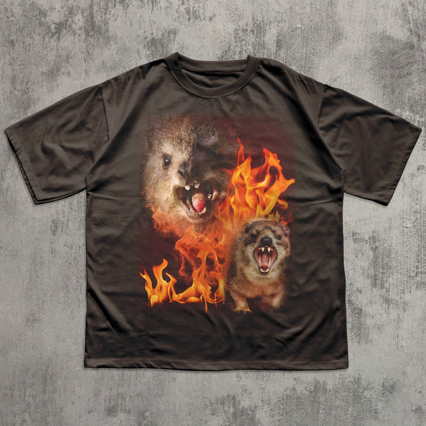 T-shirt with a graphic of two hyraxes in flames on a textured gray background