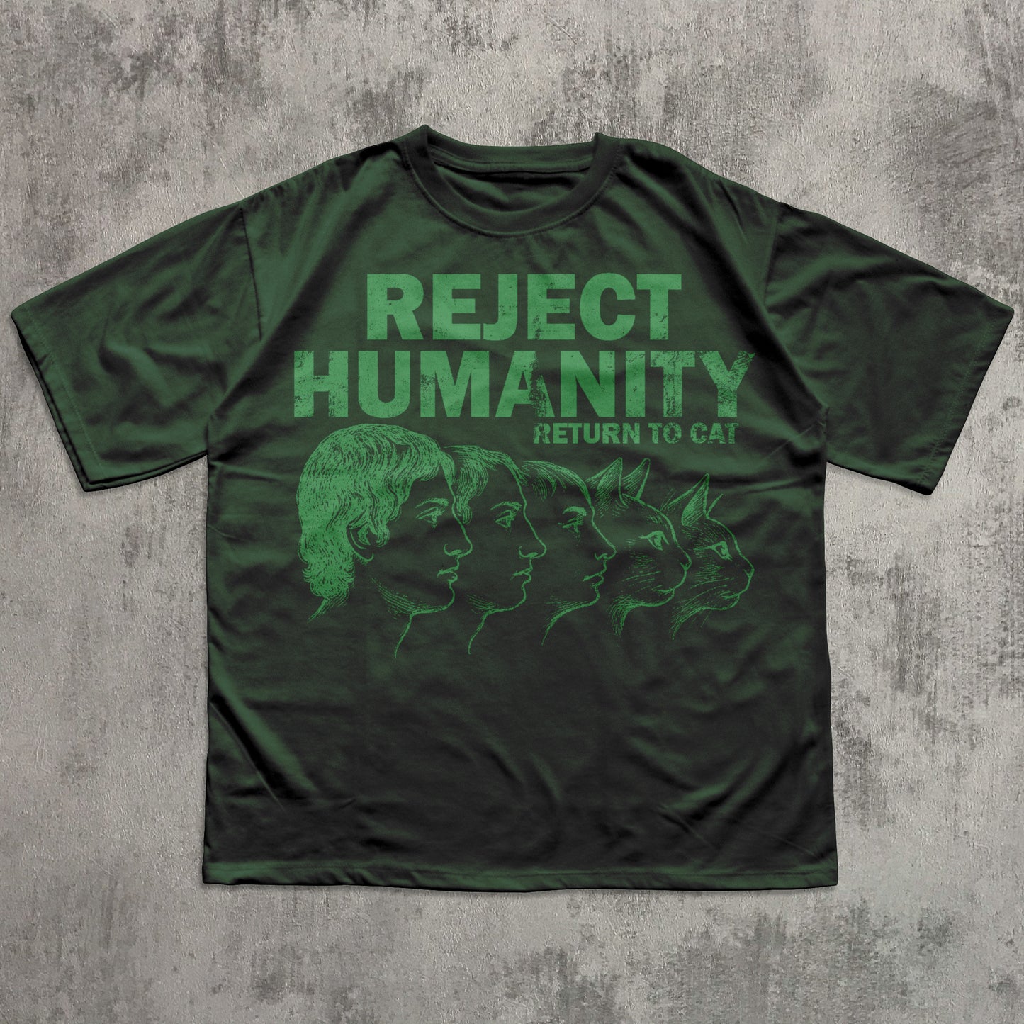 Green t-shirt with 'Reject Humanity, Return to Cat' text on a textured gray background