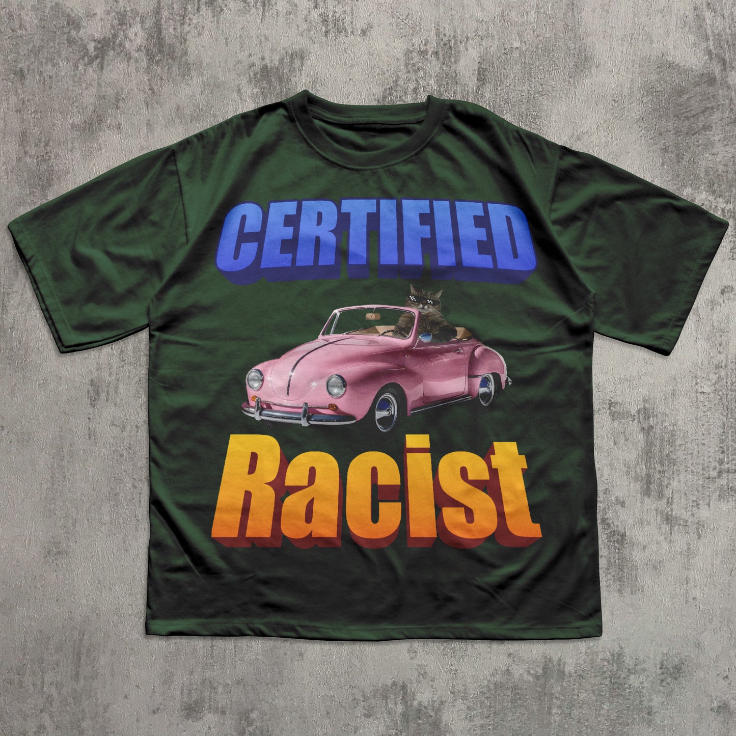 Green funny cat meme t-shirt with a graphic of a pink car and text on a concrete surface