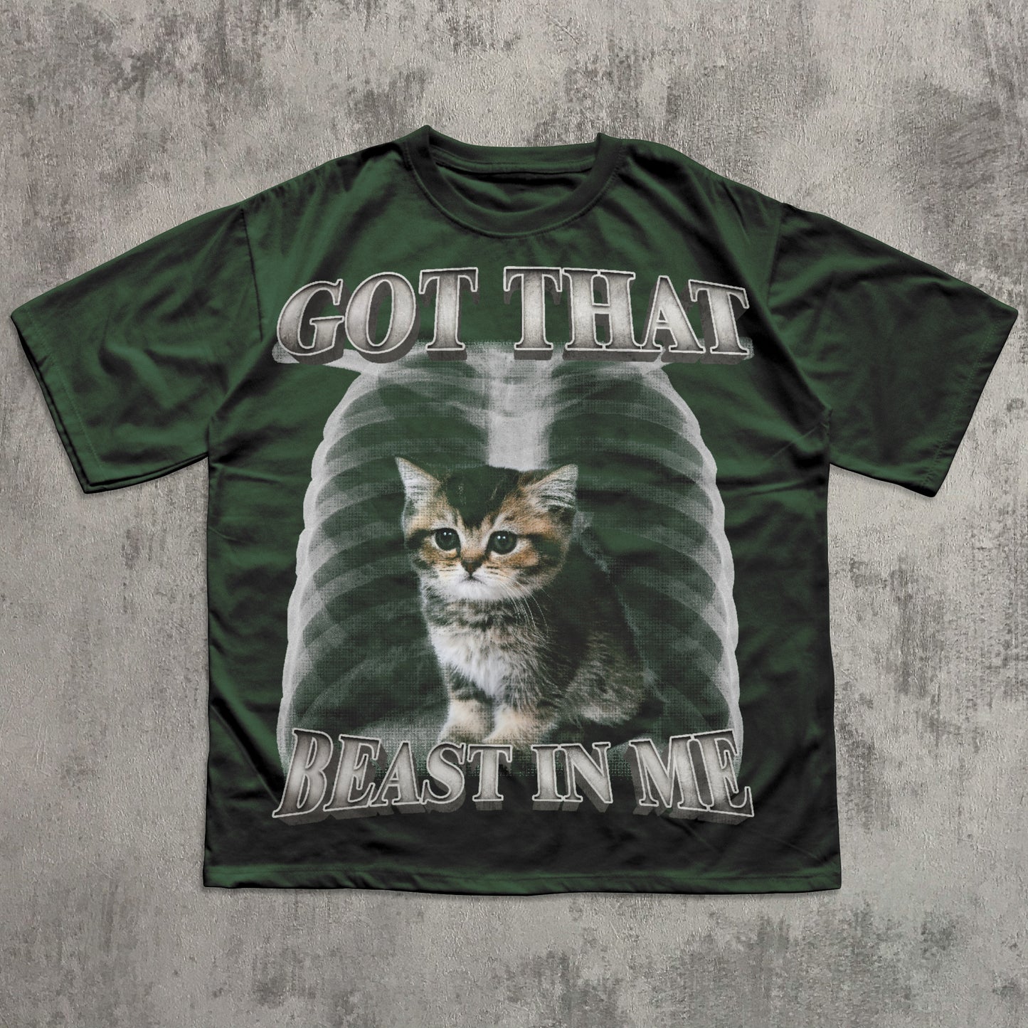 Green t-shirt with a cat graphic and text on a textured gray background