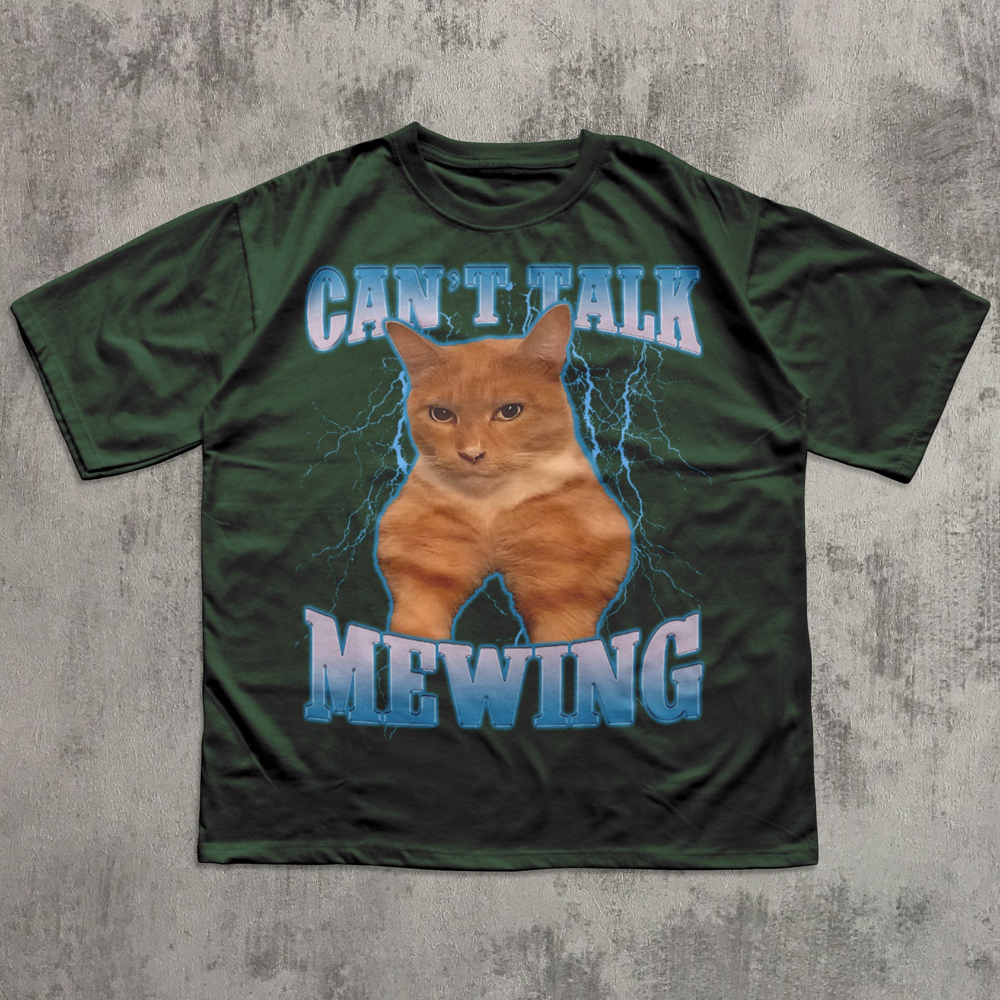 Funny Green t-shirt with a cat graphic and text 'CAN'T TALK MEOWING' on a textured gray background