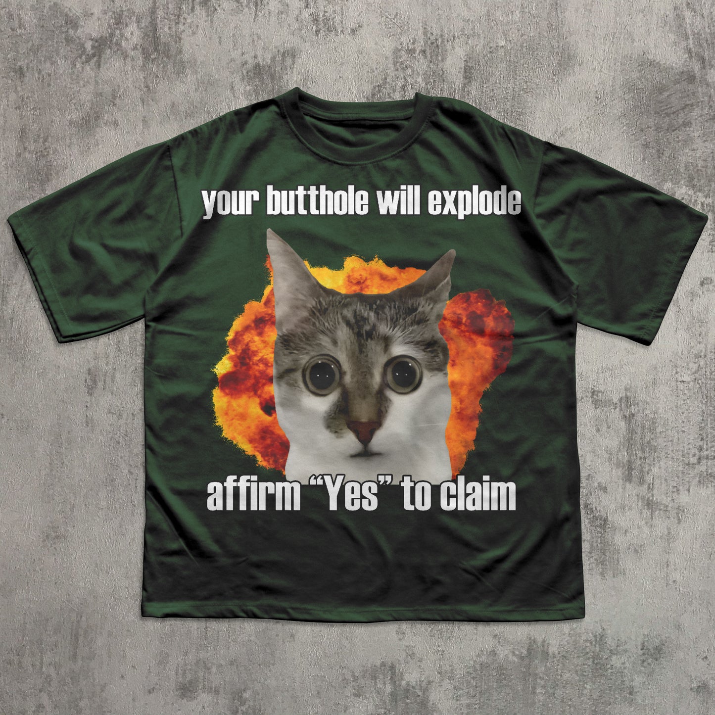 Funny meme Green t-shirt with a graphic of a cat's face amidst flames and text on a concrete background