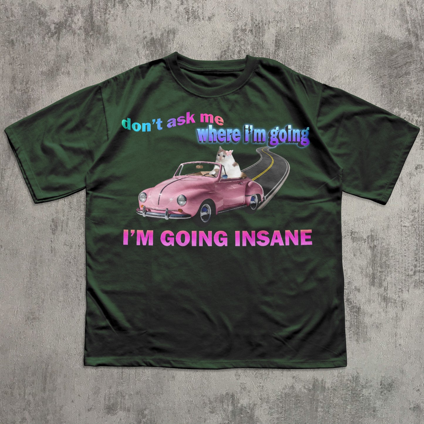 Funny cat meme green t-shirt with a graphic of a pink car and text on a gray background