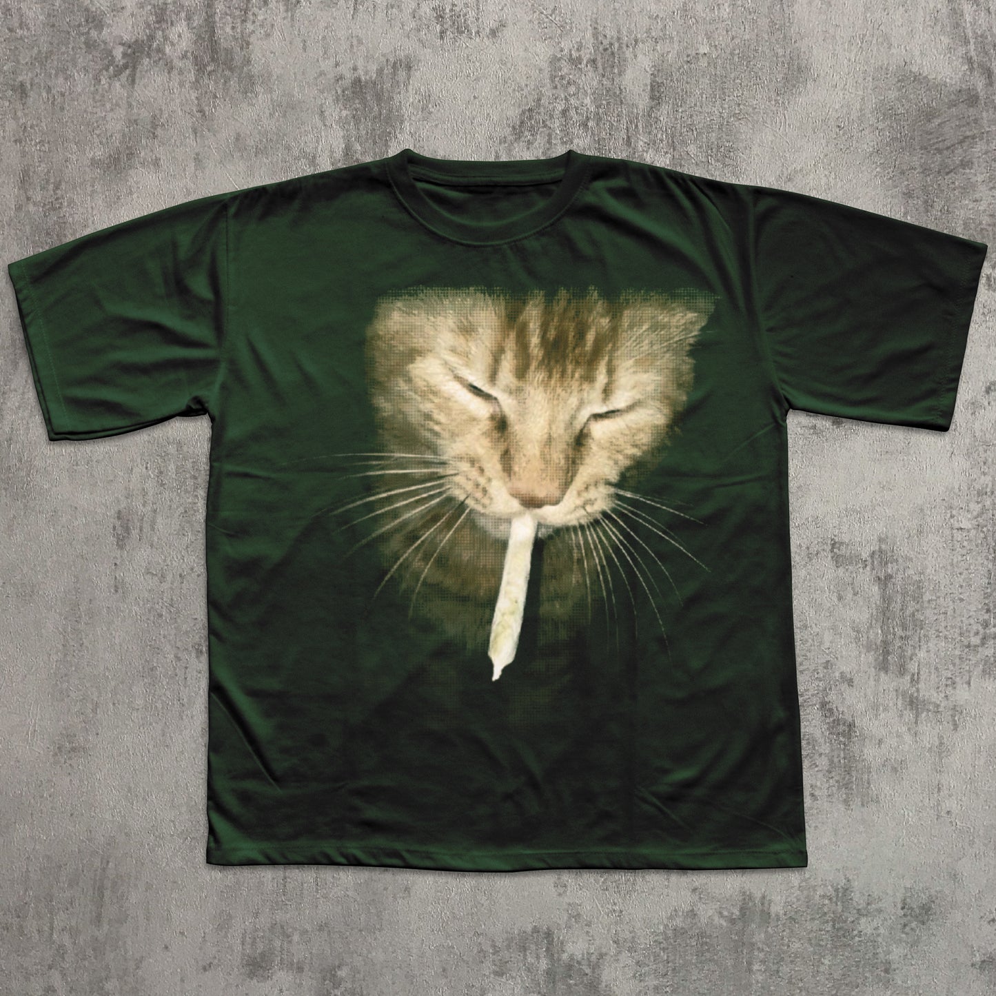 Green t-shirt with a cat graphic on a textured gray background
