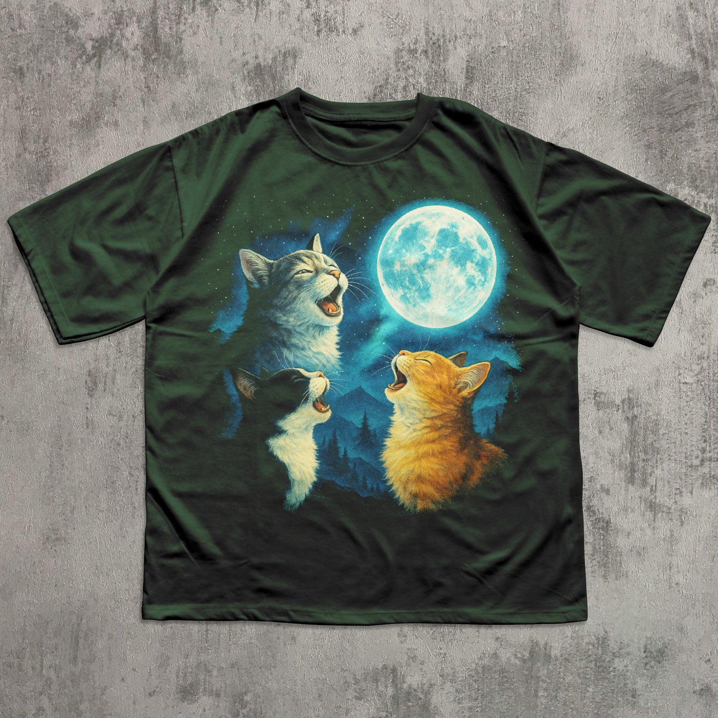 T-shirt with a design of three cats howling at a moon on a concrete surface
