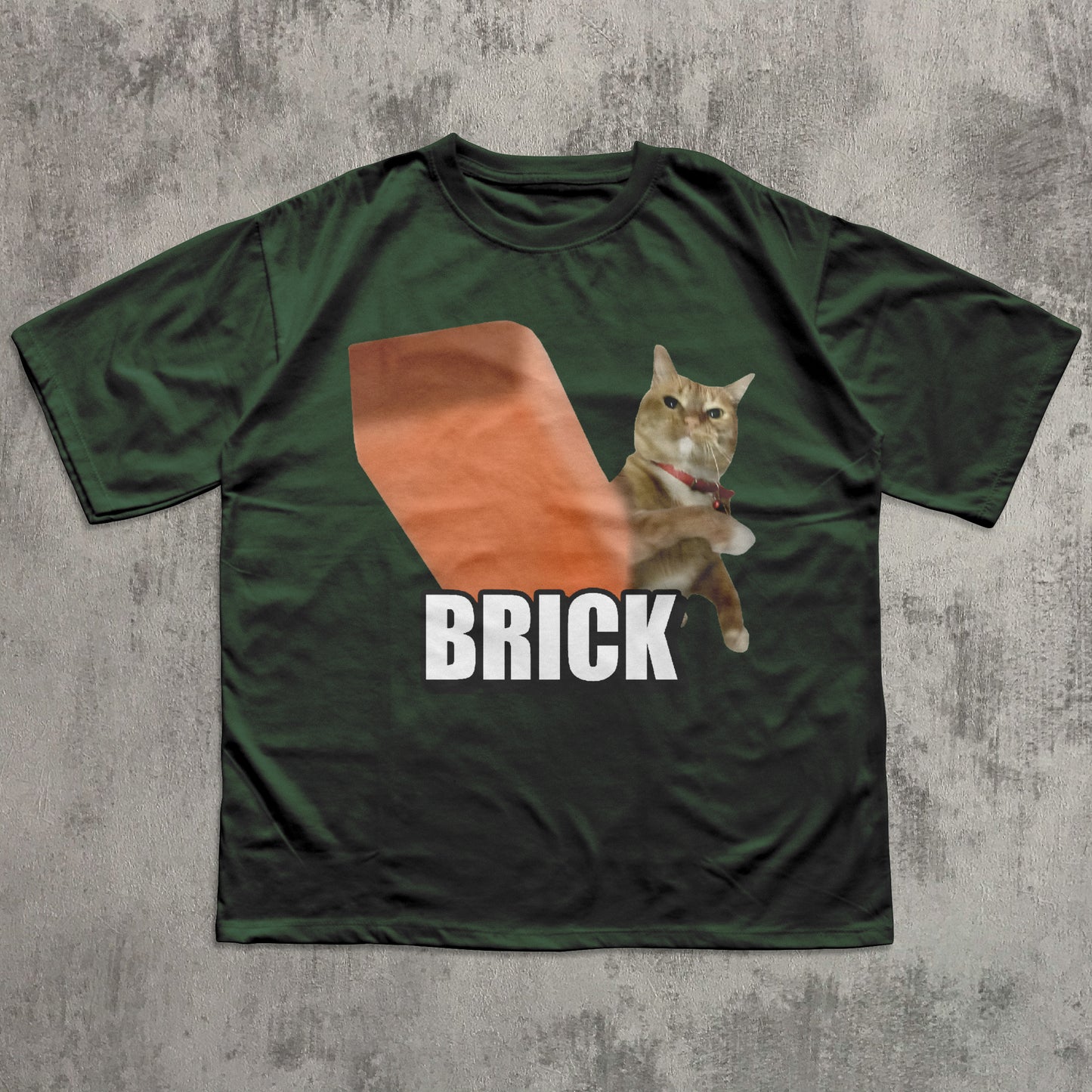 Green t-shirt with a cat graphic and 'BRICK' text on a textured gray background