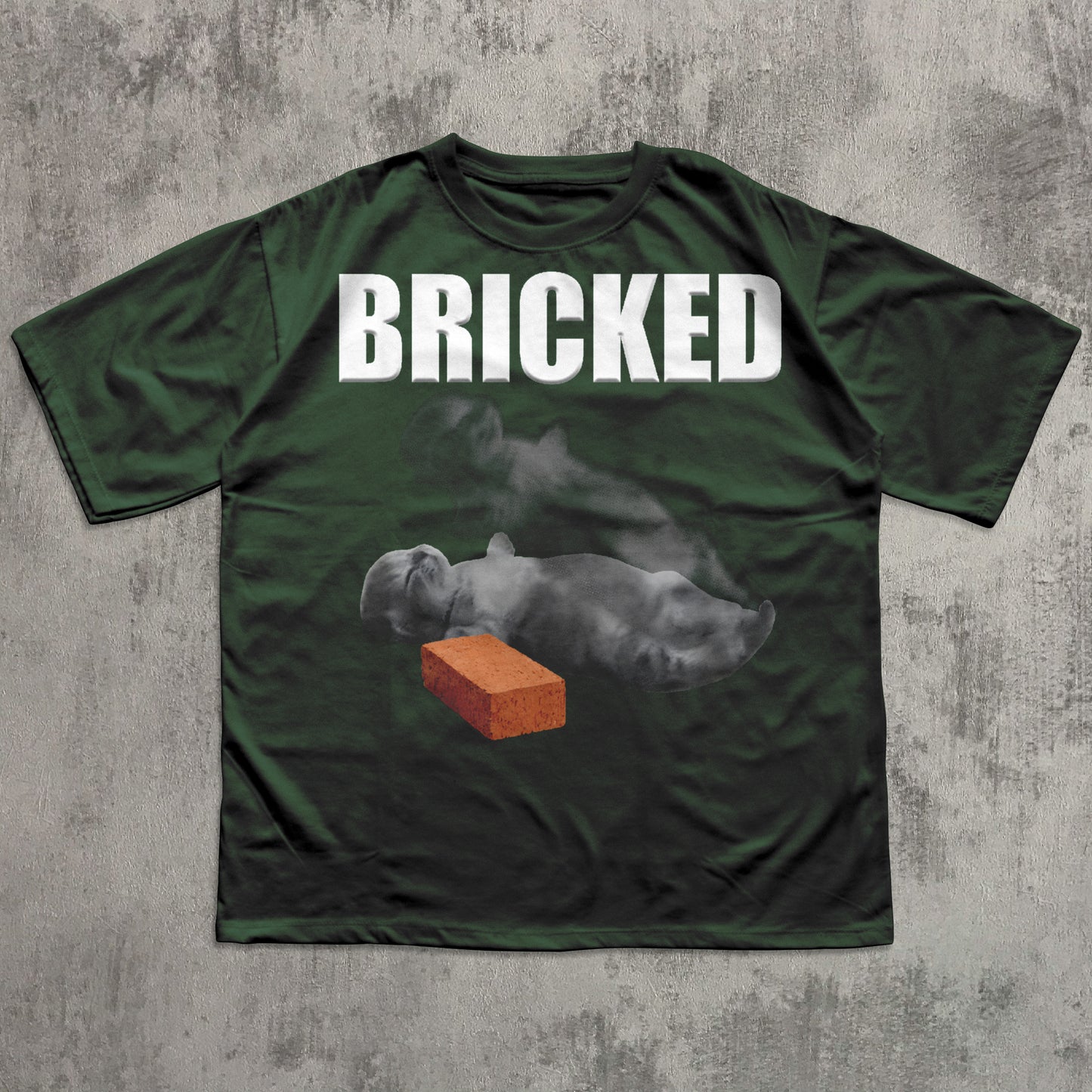Green t-shirt with 'BRICKED' text and graphic of a Cat with a brick on a concrete background
