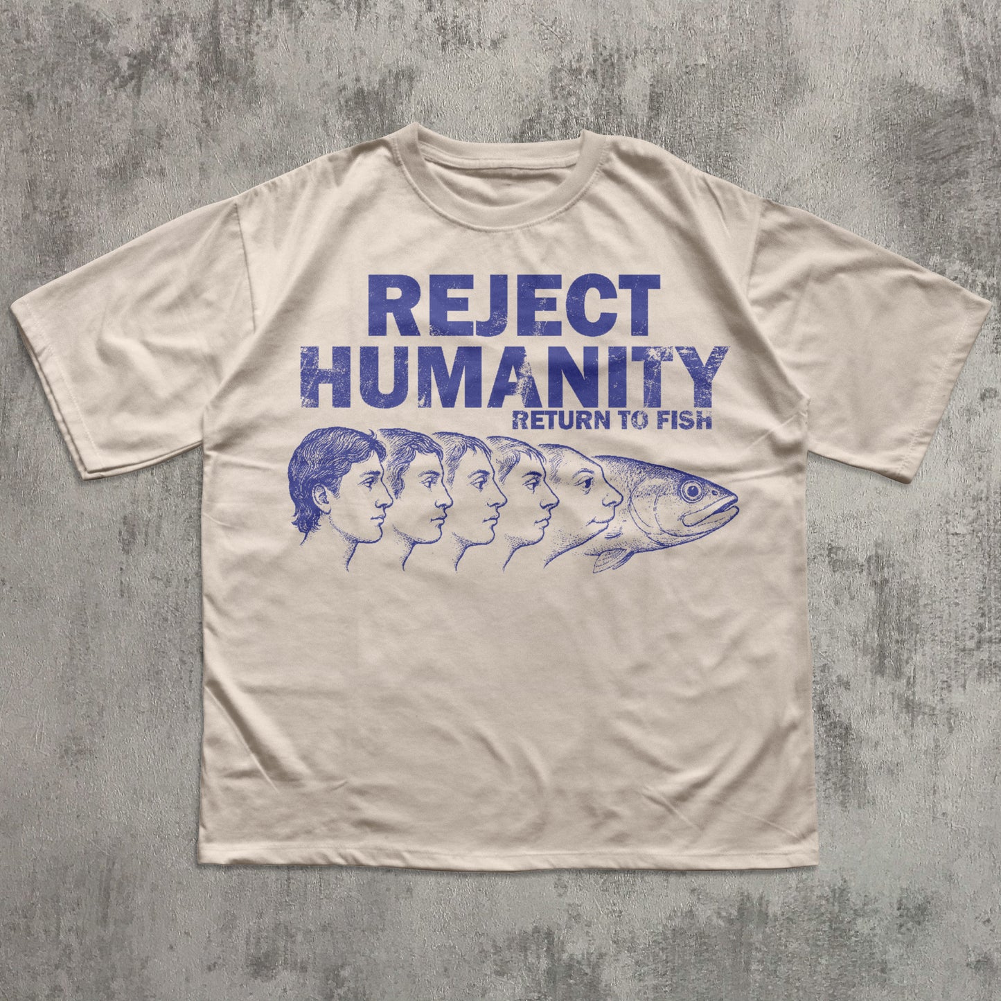 Beige t-shirt with blue graphic and text on a textured gray background