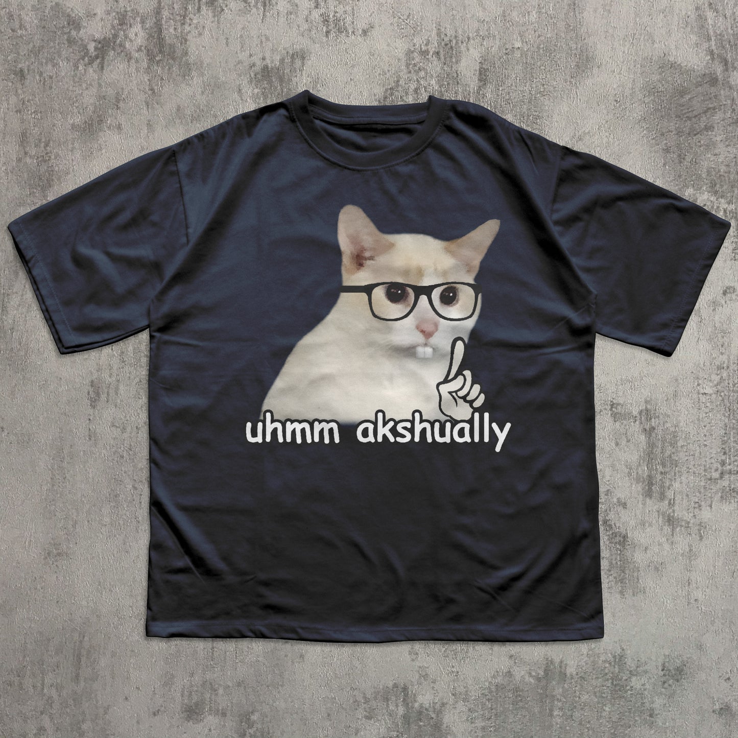Funny Navy t-shirt with a cat graphic and text 'uhmm akshually' on a textured gray background