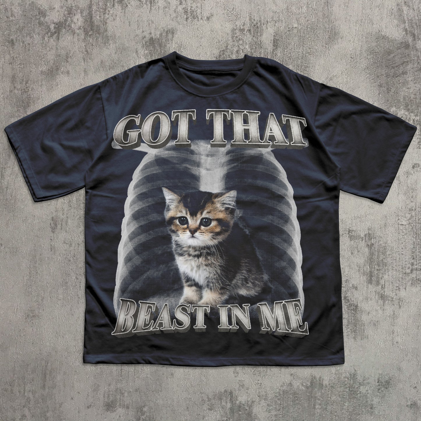 Black t-shirt with a graphic of a cat and text 'GOT THAT BEAST IN ME' on a textured gray background