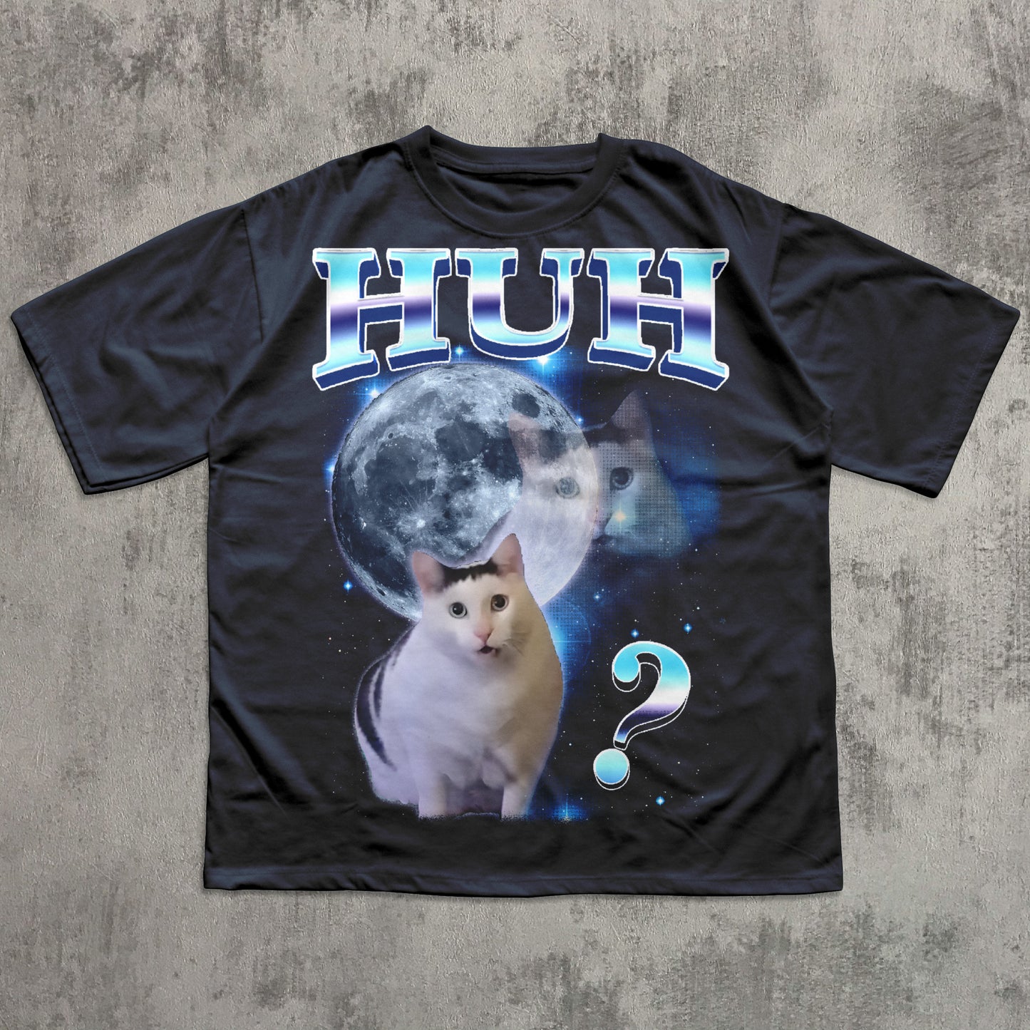 Black t-shirt with a cat graphic and 'HUH?' text on a textured gray background