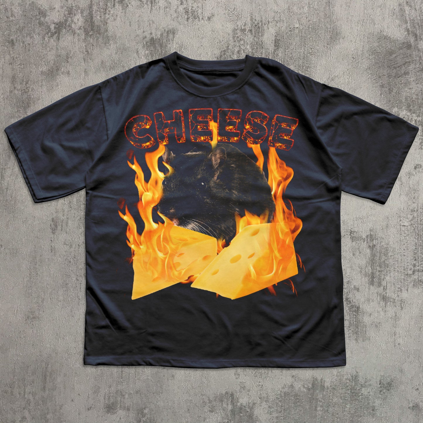 Black t-shirt with 'CHEESE' text and flame design on a concrete surface