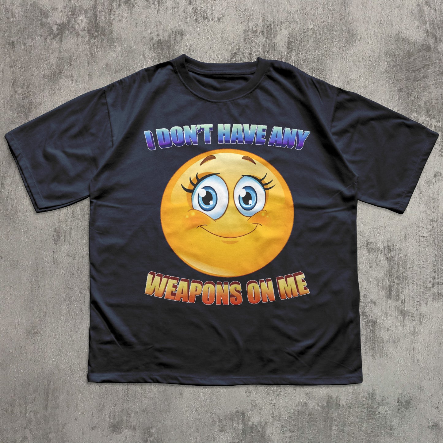 Black t-shirt with a smiley face and text on a gray textured background