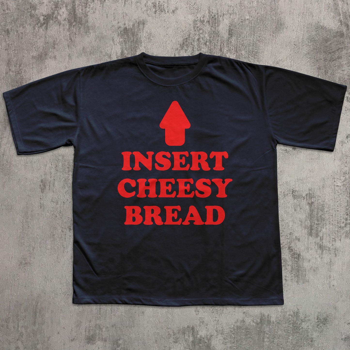 Black t-shirt with red graphic and text 'INSERT CHEESY BREAD' on a textured gray background