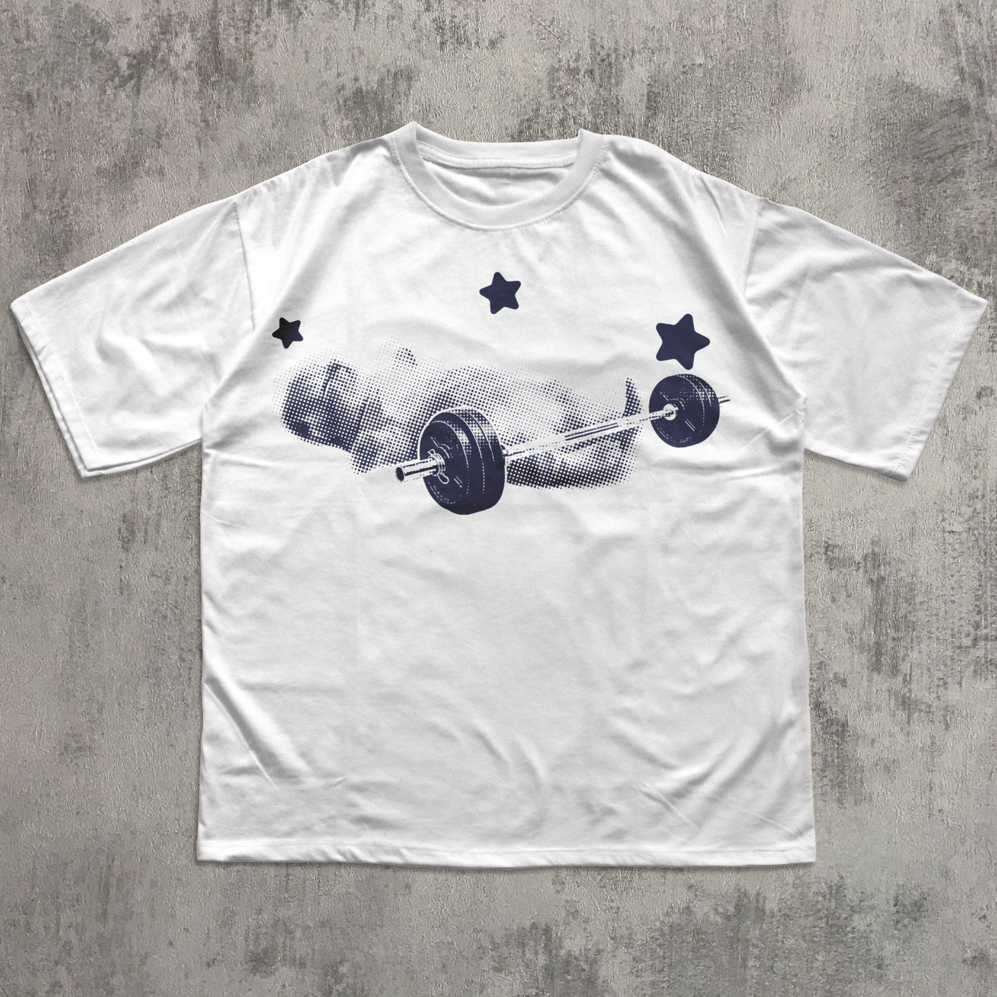 White t-shirt with a graphic design of a barbell and cat on a concrete surface