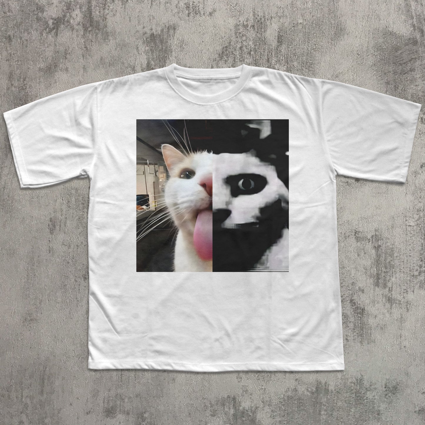 White t-shirt with a graphic of a cat on a textured gray background