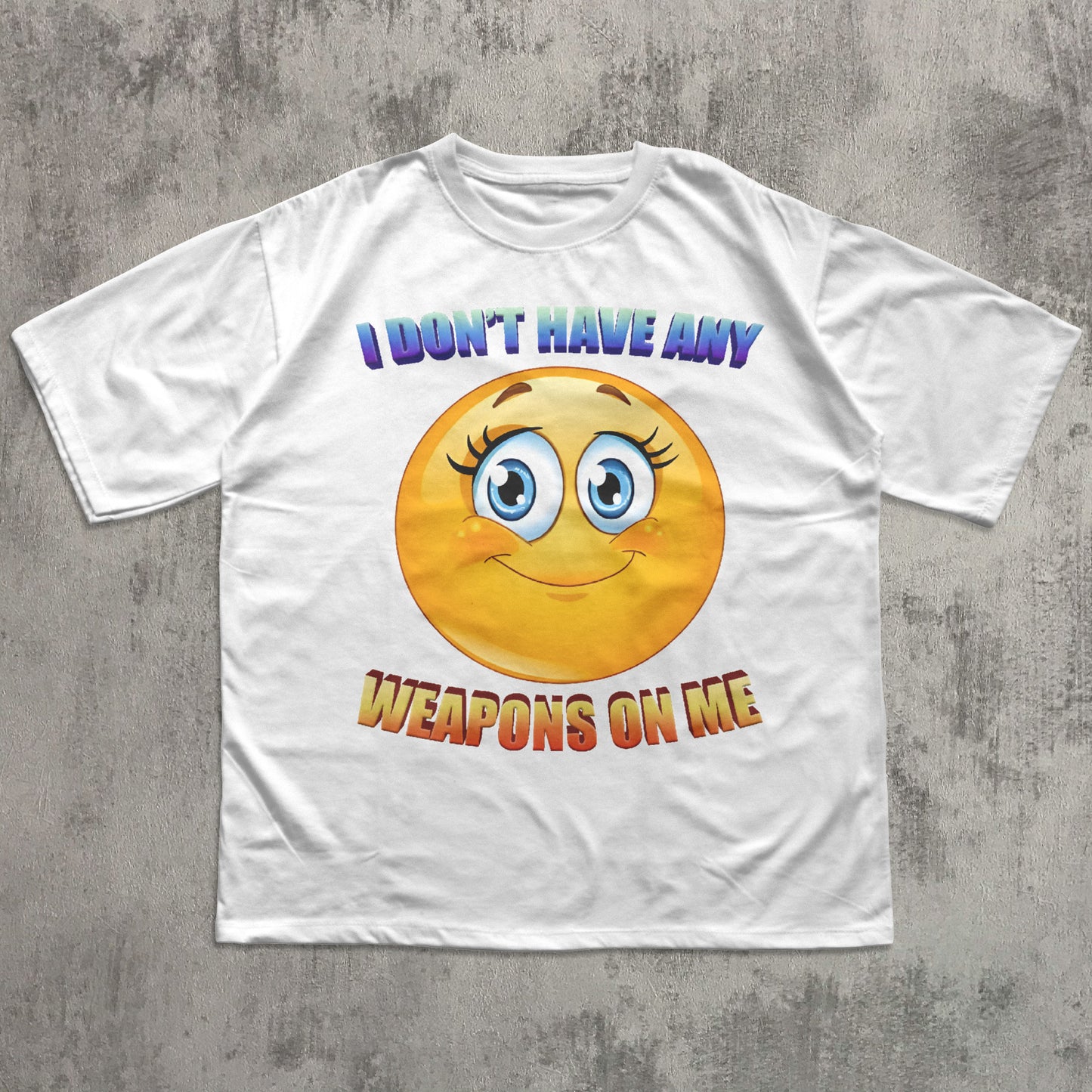White t-shirt with a smiley face and text on a gray concrete background