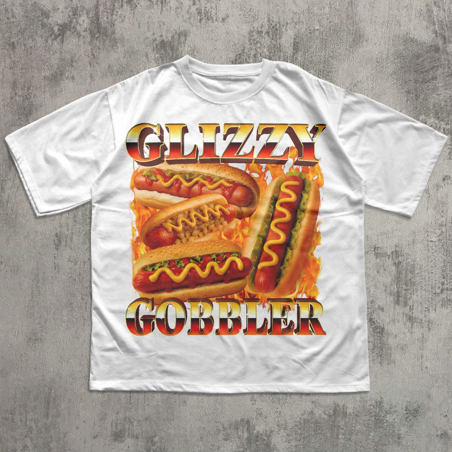 White t-shirt with 'Glizzy Gobbler' hot dog graphic on a concrete surface