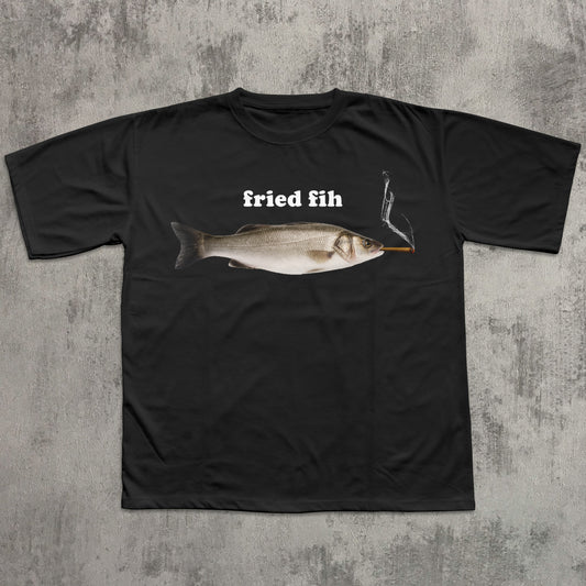 Black t-shirt with a fish graphic and text 'fried fih' on a textured gray background