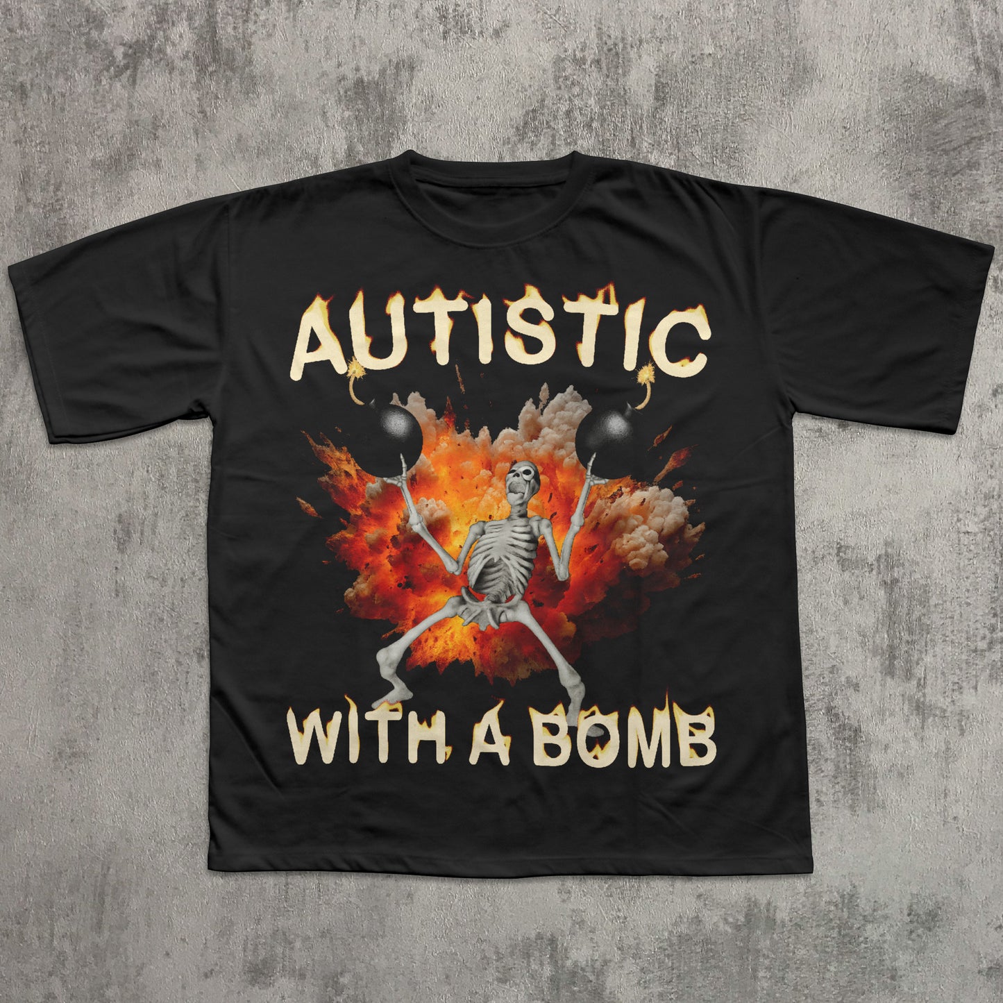 Black t-shirt with a skeleton design and 'Autistic with a Bomb' text on a concrete surface