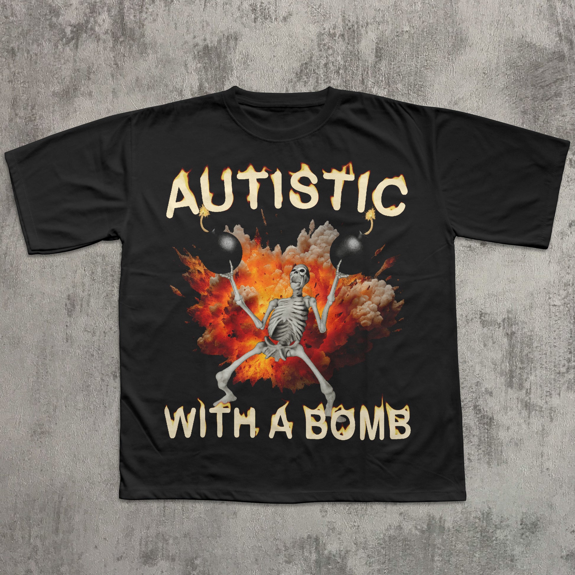 Black t-shirt with a skeleton design and 'Autistic with a Bomb' text on a concrete surface