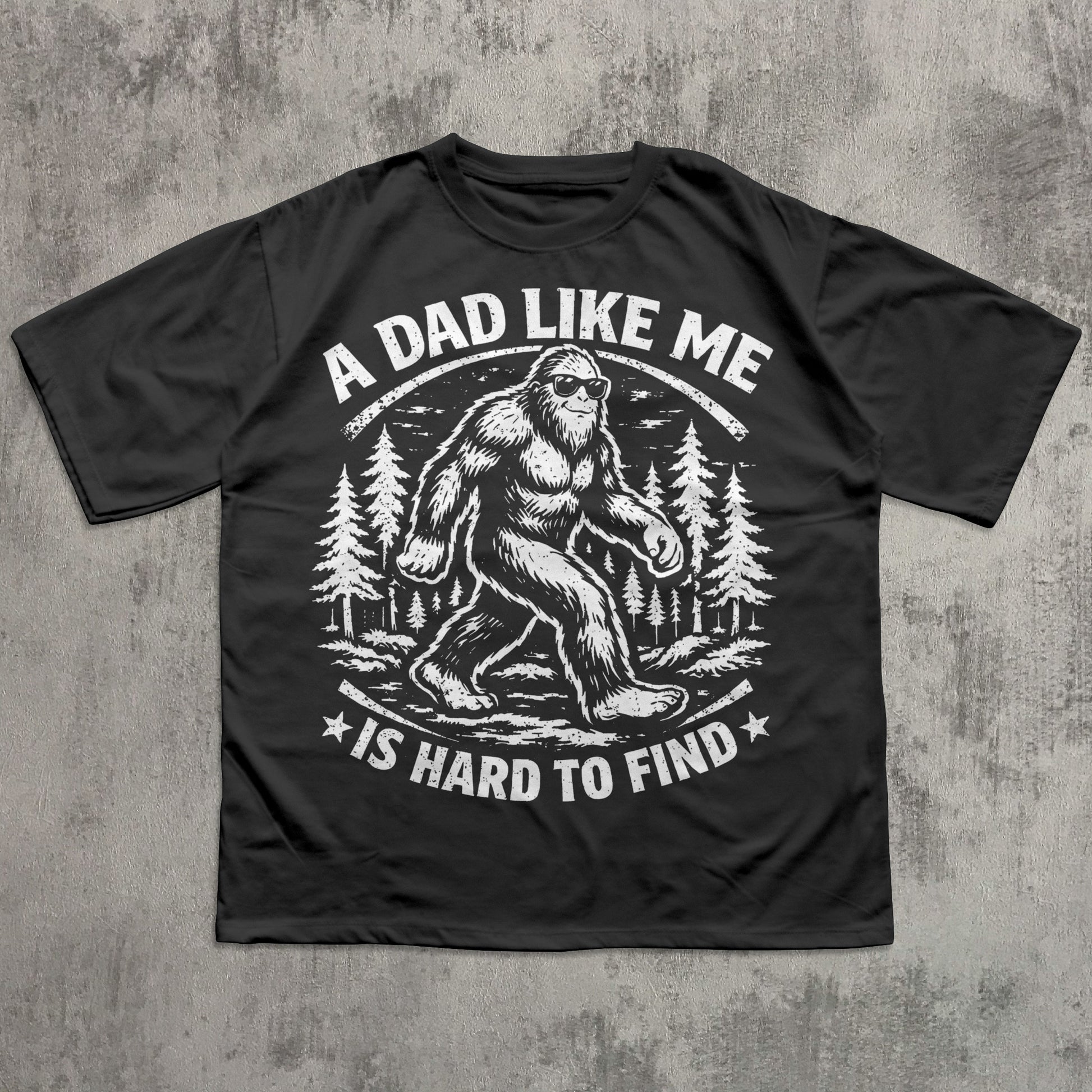 Black funny Bigfoot dad T-shirt featuring vintage Sasquatch graphic in forest with sunglasses and slogan “A Dad Like Me Is Hard to Find” – novelty Father’s Day gift tee for outdoorsy dads