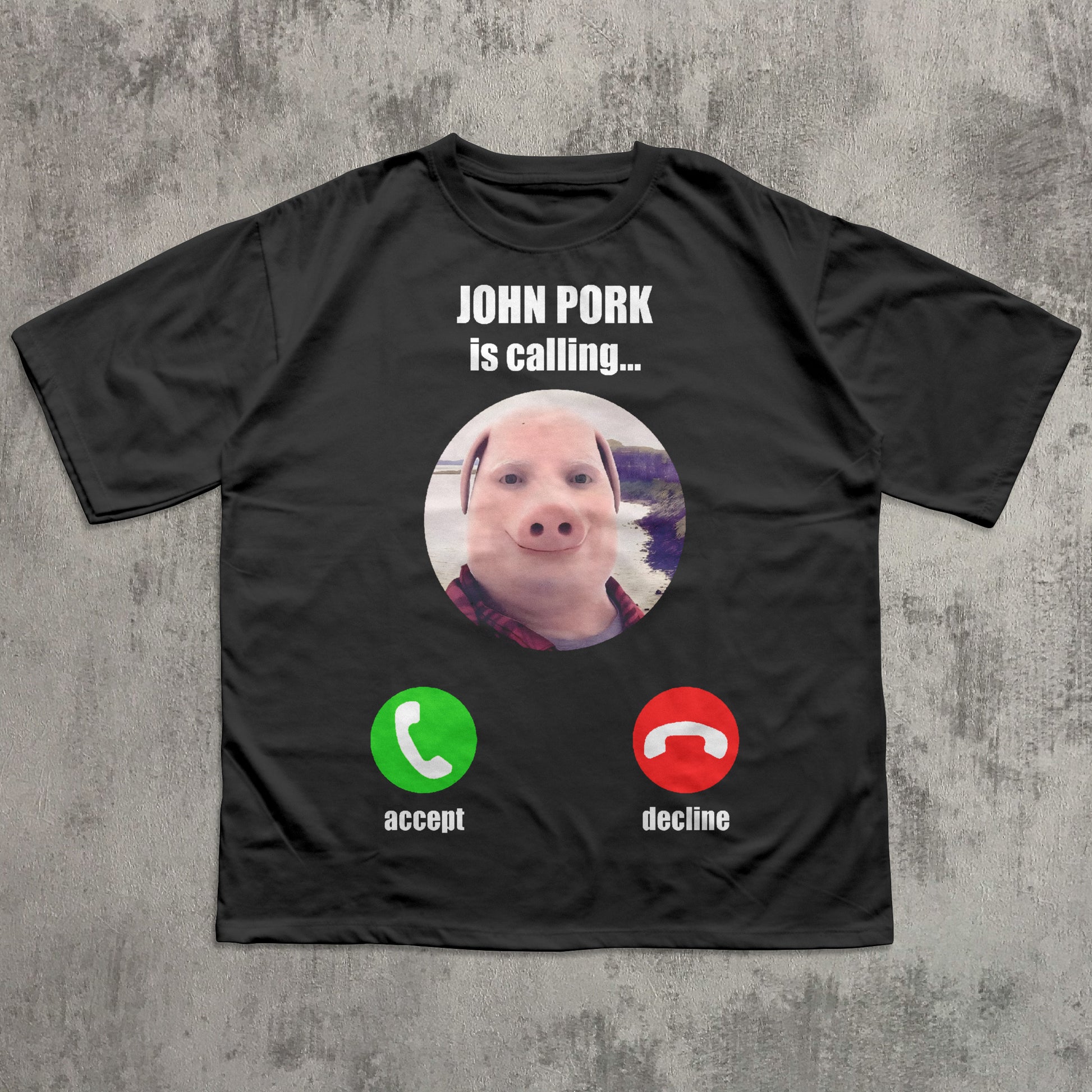 funny brainrot Black t-shirt with a graphic of a pig and phone icons on a concrete surface