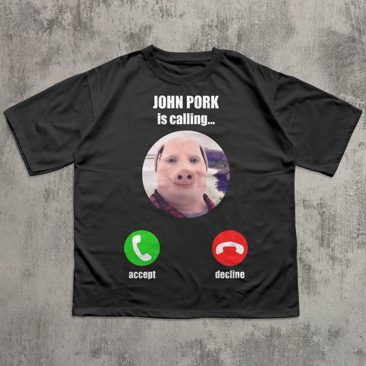 funny brainrot Black t-shirt with a graphic of a pig and phone icons on a concrete surface