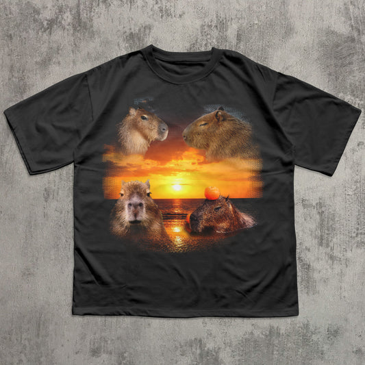 Black t-shirt with capybara design on a sunset background
